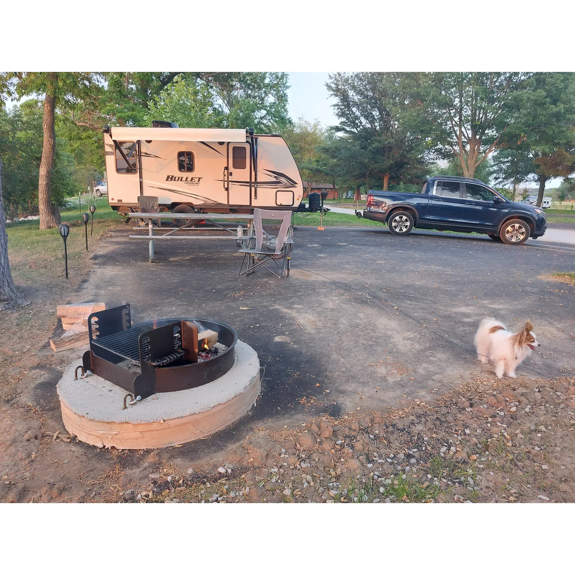 Boulder Campground is a pristine outdoor paradise, offering visitors a delightful experience beneath the open skies. Ideal for both adventure seekers and relaxation enthusiasts alike, this campground stands out due to its immaculately maintained facilities. The clean restrooms, replete with pleasantly fragrant showers that are complimentary for guests, showcase the attentive upkeep of the amenities.

Boasting a very nice Corps of Engineers design, the campground features paved parking pads and spacious sites, accommodating both tents and RVs with generous areas to unwind. Guests can marvel at the magnificent sunsets, creating lasting memories against the backdrop of captivating natural beauty.

Located by Illinois' largest lake, Boulder Campground is a jewel for water enthusiasts and anglers, offering a tranquil haven for boating and fishing activities. While there may not be walking trails within the campground, the surrounding landscape is perfect for leisurely bike rides or simply soaking in the peaceful atmosphere.

A welcome addition for long stays is the laundry facility, ready for use with a pocketful of quarters. Pet owners will find the campground to be a friendly space for their furry companions, with a playground available for additional family fun. Recent upgrades include new blacktop pads and electric posts, signalling the campground's commitment to providing excellent infrastructure for its guests.

Visitors can also enjoy the convenience of potable water spigots and a dump station, ensuring all camping necessities are catered to. Most sites offer electric 30/50 Amp service, with a few providing full hookups for a more comprehensive camping setup.

A small camp store located at the marina ensures that essentials are never too far away, and while the evening may introduce some flying visitors, the overall experience remains unspoiled by their presence.

The campground's ambiance is exemplified by the hospitality of the hosts, who are known for their helpfulness and warm welcoming nature. This, combined with the staggering views and pristine condition of each site, ensures that any length of stay at Boulder Campground, no matter how brief, is a visit to cherish.

Overall, Boulder Campground is synonymous with a quiet, peaceful retreat, overflowing with charm and boasting a community spirit where both people and pets come together, even in moments of unexpected adventure like a tornado warning. This unique campground has evolved from great to excellent, guaranteeing that each visitor departs with a deep-seated desire to return. Description by ChatGPT.