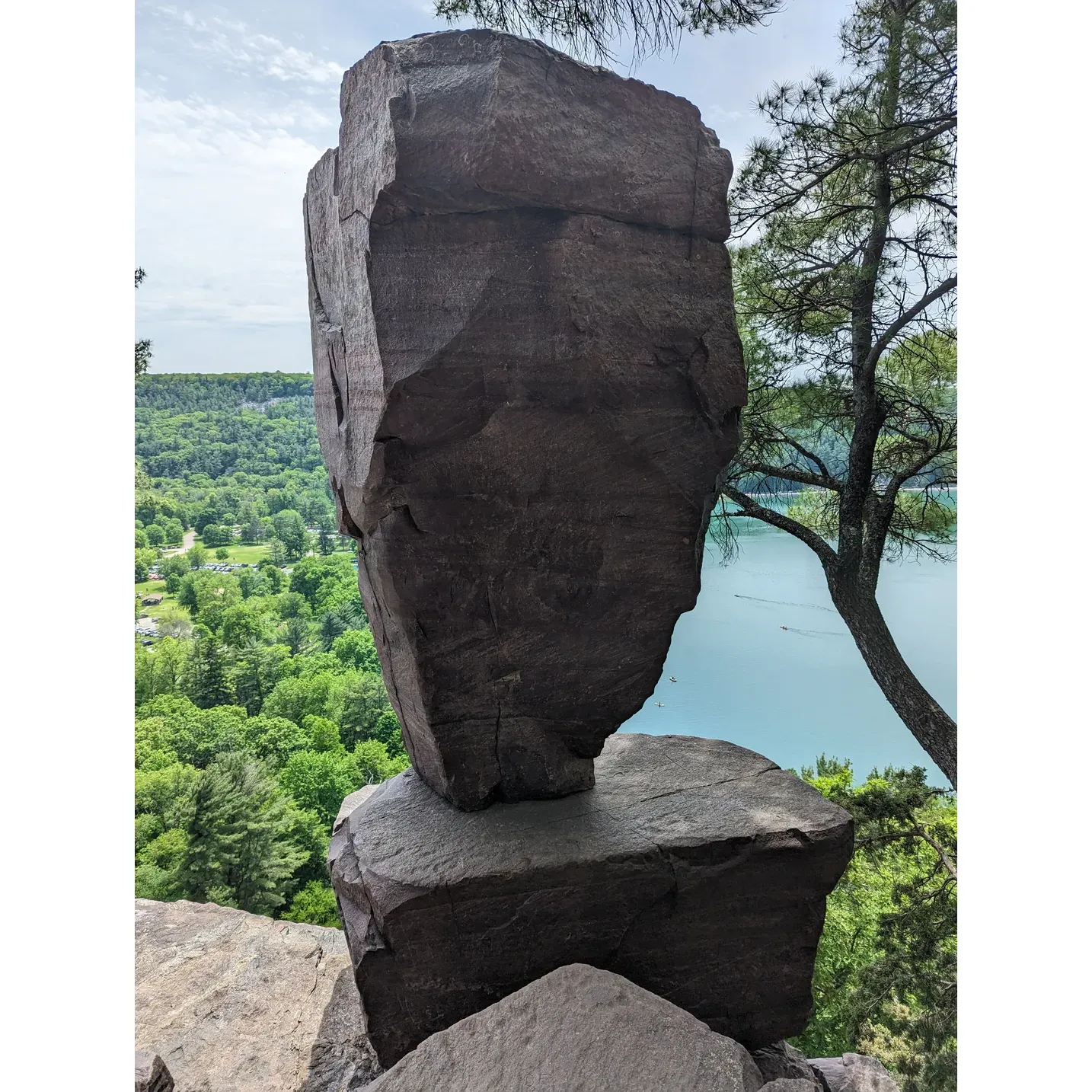 Devil's Lake State Park captivates visitors with its crystalline lake, offering respite with refreshing swims, serene paddle boating, and leisurely beachside relaxation. A sun-soaked haven, the park provides an idyllic sandy retreat perfect for unwinding on warm days.

Enthusiasts rave about the park's tapestry of trails that weave through verdant forests and ascend rolling hills, each route presenting a new tableau of the lake's beauty and the surrounding topography. With trails ranging from gentle to challenging, the park caters to all levels of adventurers, ensuring an invigorating experience tailored to your preference.

Climbing enthusiasts are drawn to the park's boulders and rock faces, finding routes that are as accommodating to novices as they are exhilarating for the seasoned experts. Scaling these heights is not just a physical pursuit but a journey to breathtaking vistas that showcase the park from a vantage point like no other.

Picnics amidst nature’s embrace offer a delightful dining experience, allowing guests to feast in the great outdoors, while the option of camping amidst the stars adds a touch of magic to any visit, whether with family or friends.

The park is a sanctuary for wildlife, with deer and an array of bird species adding to the rich tapestry of natural wonders. Every turn on a trail, or a quiet moment by the lake, could reveal an enchanting glimpse of the park's inhabitants.

Revered by both locals and visitors, Devil's Lake State Park is a destination where memories are forged amidst the beauty of its landscape and the plethora of activities it offers. From the thrill of exploration to the calm of lakeside repose, this treasure of Wisconsin is a beckoning oasis for all seeking a serene escape or an active getaway. Description by ChatGPT.