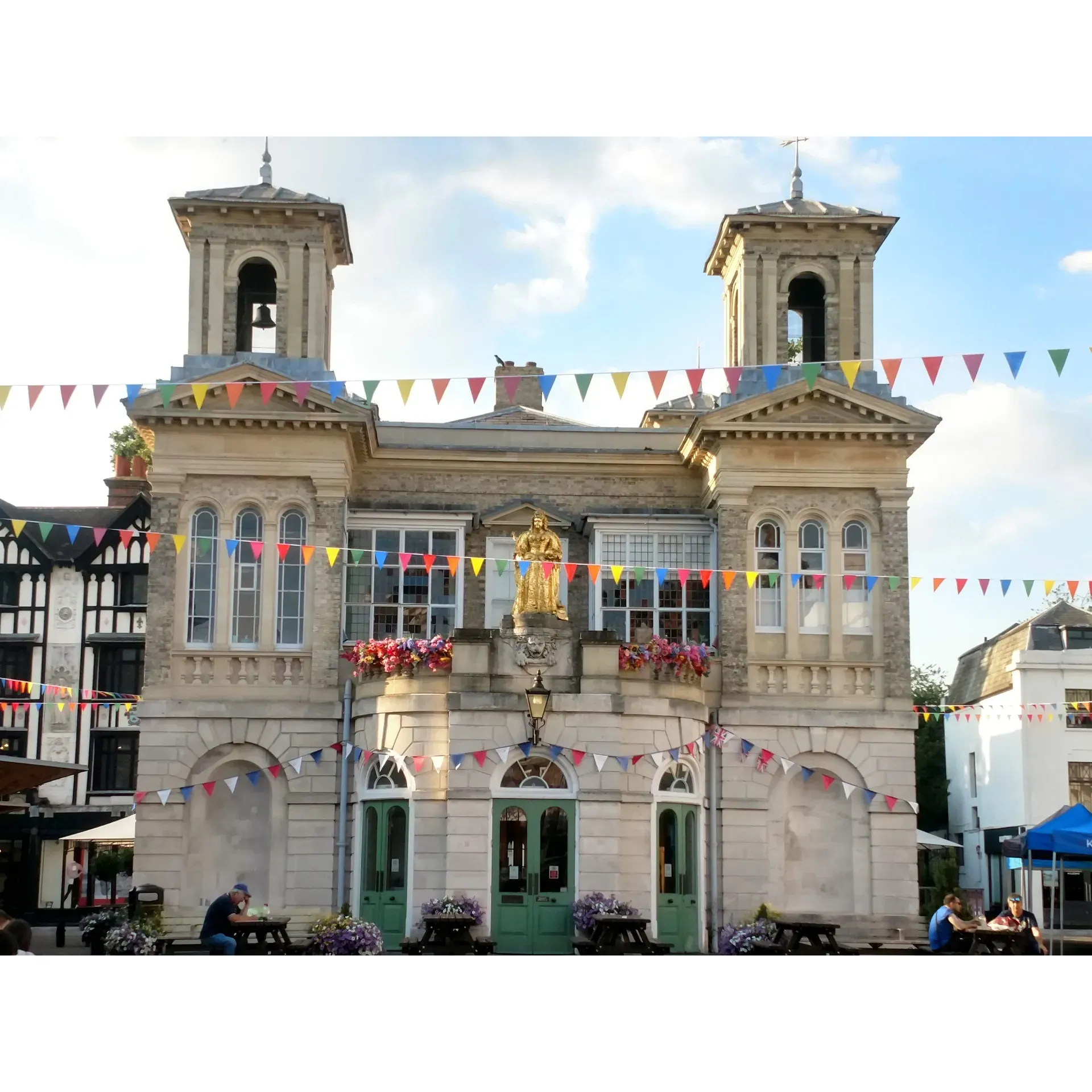 Market Place is a vibrant shopping destination located in the heart of Kingston upon Thames, UK. It is conveniently situated on Market Pl, offering a mix of high street brands, independent retailers, and a variety of dining options. 

The market itself dates back to the 13th century and continues to be a bustling hub of activity, with stalls selling fresh produce, local crafts, and unique gifts. Market Place also hosts regular events and pop-up markets, providing visitors with a fun and lively shopping experience.

In addition to shopping and dining, Market Place is easily accessible by public transportation and offers convenient parking options for those traveling by car. Whether you're looking for a place to shop, eat, or simply enjoy the lively atmosphere, Market Place has something for everyone. Description by ChatGPT.