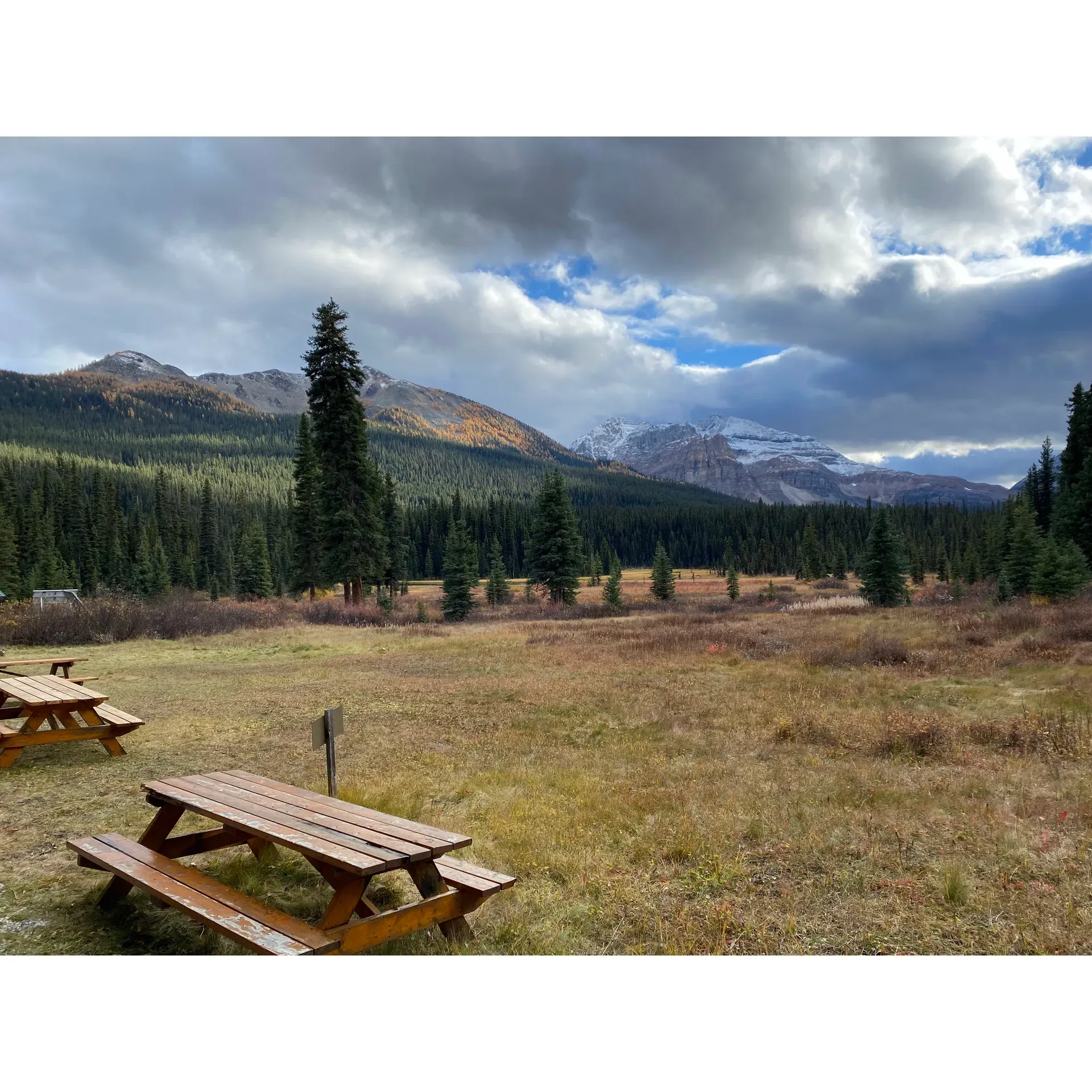 Shadow Lake Backcountry Campground RE14 offers an enchanting escape for nature enthusiasts seeking a serene outdoor experience in the heart of one of Canada's most picturesque natural landscapes. With its limited number of campsites, this cozy campground promises an intimate and tranquil retreat, surrounded by the pristine beauty of towering trees and the freshest of mountain air.

Just a stone's throw away from the Shadow Lake Lodge, campers revel in the delightful aromas from the nearby grill and barbecue, which enhance the rustic ambiance and outdoor charm. The proximity to the lodge offers a unique blend of backcountry adventure with a hint of nearby civilization—an olfactory treat that underscores the wilderness culinary experience.

The campground boasts a well-established cooking and food storage area to ensure safe and convenient meal preparation. While the amenities prioritize the safety and comfort of visitors, they also encourage responsible camping practices to preserve the environment and coexist harmoniously with the local wildlife. The central table serves as a social hub where stories and laughter can be shared under a canopy of stars, fostering a sense of camaraderie among travelers.

Although the campground is distinguished by its tranquil atmosphere, adventure is never far. A scenic trek from the campsite leads to the breathtaking Shadow Lake, a destination worth the journey, promising picturesque views and photo opportunities that capture the essence of the region's natural splendor.

Shadow Lake Backcountry Campground RE14, with its well-planned layout and proximity to a gourmet scent trail, is a delightful base for adventurers looking to explore the wonders of Banff National Park. It stands as an unparalleled retreat for campers yearning to connect with nature and immerse themselves in the peaceful rhythms of the backcountry. Description by ChatGPT.