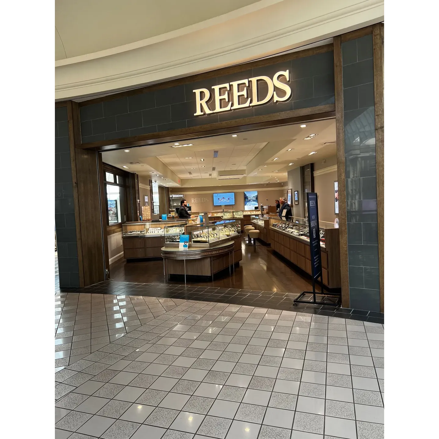 REEDS Jewelers stands as a beacon of exceptional service and dazzling craftsmanship in the realm of fine jewelry. At the heart of their customer experience is the remarkable Jeff, whose dedication to ensuring satisfaction is evident in the glowing testimonials of patrons. Whether it's for a milestone event or a precious addition to a personal collection, Jeff's ability to curate the perfect piece and deliver it on schedule embodies the store's commitment to excellence.

From wedding parties to jewelry upgrades, REEDS Jewelers consistently leaves clients enamored with jaw-dropping selections that echo the brand's reputation for unforgettable elegance. The team, including the praised Mehnaz K and Justin, elevates every encounter with personalized attention, demonstrating a level of care and hospitality that extends far beyond a mere transaction. Customers appreciate the ease of the process, the unhurried approach to making the perfect choice, and the delightful interaction that even the youngest visitors can enjoy.

As the first choice for many when it comes to exquisite jewelry, REEDS Jewelers at Carolina Place in Charlotte, NC, has solidified its place in the hearts of its clientele. The assurance of outstanding service, the visualization of jewelry dreams coming to fruition, and the perpetual aim to exceed expectations define the REEDS experience. It is a haven where the brilliance of gems is matched only by the brilliance of customer satisfaction, making it a destination for those seeking treasures that will be cherished for a lifetime. Description by ChatGPT.