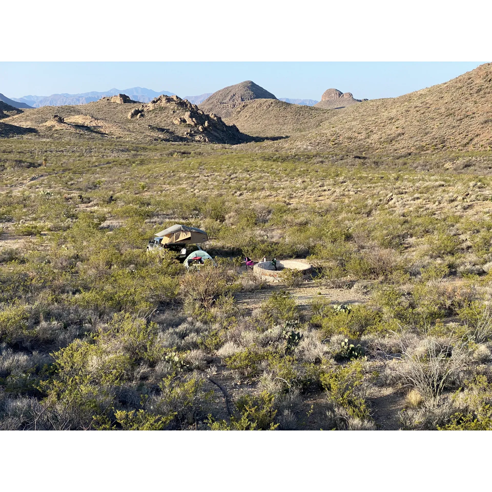 Los Cuates Campsite is an idyllic getaway for adventurers seeking solitude and a connection with nature away from the buzz of the modern world. Embraced by a serene valley and accessible via an exhilarating trail that adds to the experience, it offers a truly off-the-grid retreat. Visitors can enjoy the spectacle of sunrise cascading over eastern mountain peaks, ensuring a refreshingly cool start to the day. As evening descends, the sun retreats beyond the western mountains, allowing for tranquil, cool evenings perfect for stargazing and quiet reflection. The campsite's remote charm ensures a private, undisturbed stay, making it a treasured spot for those looking to immerse themselves in the rugged beauty of the wilderness. With its stunning natural backdrop and untouched setting, Los Cuates Campsite invites campers to a peaceful escape where the bustle of everyday life feels a world away. Description by ChatGPT.