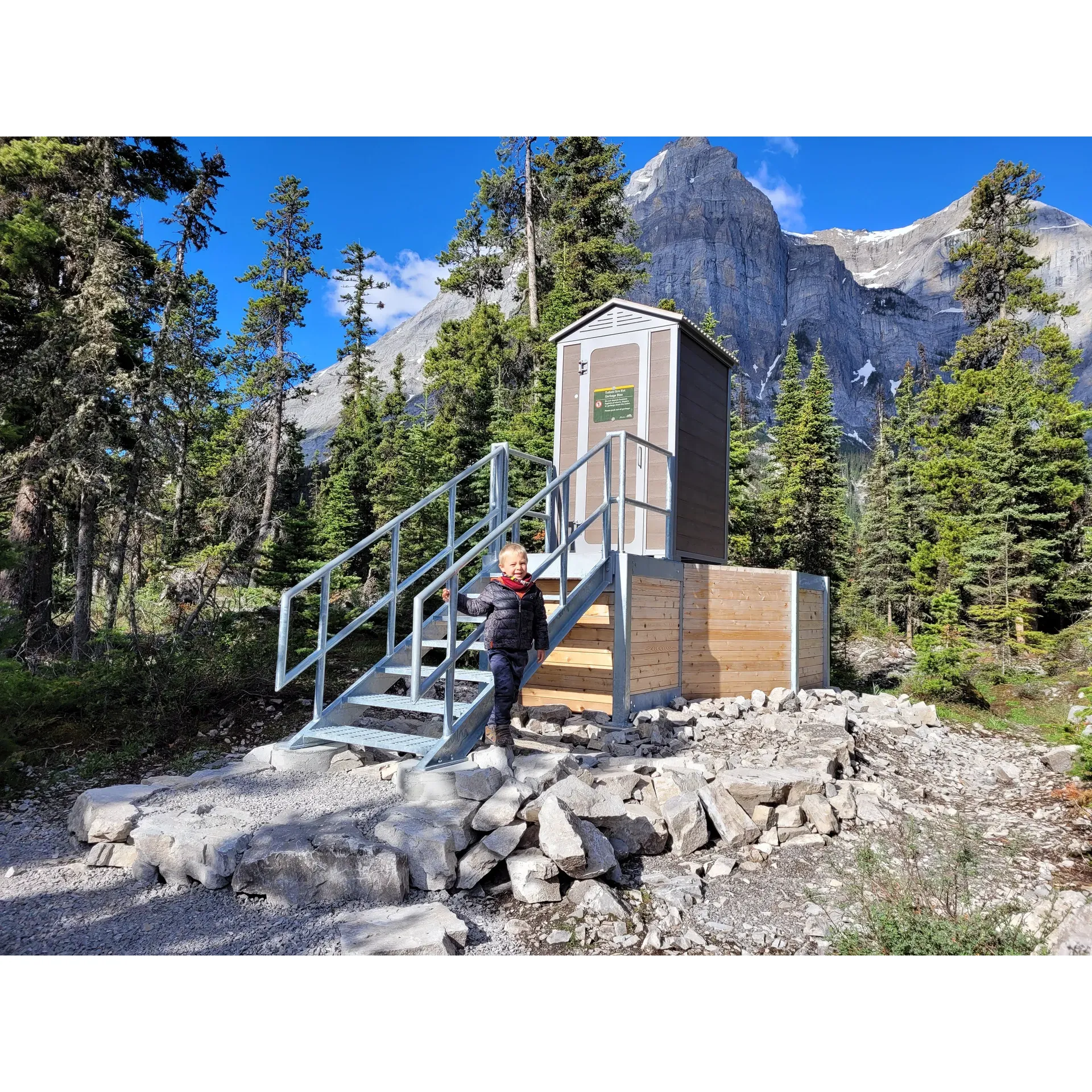 Point Campground offers an exceptional retreat for outdoor enthusiasts and backcountry adventurers. A mere hour's hike from civilization, this sanctuary awaits by the tranquil shores of Upper Kananaskis Lake, enveloped by majestic mountains that offer a serene backdrop to the incredible landscapes. The campground boasts 20 well-spaced individual sites, each providing the comfort of a firepit and picnic table, where moments by the fire and meals amidst nature become memories cherished.

For those who find their solace on the water, canoeing to your site is a breeze, with convenient access to the west side's cooking area - a thoughtfully designated space to ensure cleanliness and safety in this pristine environment. Here, strict rules on cooking and clean-up are a testament to the campground's commitment to preserving the natural beauty and wildlife that call this place home. Campers are encouraged to get involved in the Leave No More Trace ethos by packing out garbage, respecting the harmonious balance between nature and visitors.

Point Campground flourishes as an all-season destination. The colder months transform the area into a winter wonderland, complete with well-stocked wood supplies for cozy fires and the unique stillness that only a snow-cloaked landscape can provide. Our well-maintained food storage lockers and outhouses ensure that every need, no matter how basic, is met with care, cementing the campground’s reputation for amenity quality.

First-time backpackers and seasoned hikers alike find comfort in the campground's easy-to-navigate trails, minimal elevation gain, and the peaceful seclusion of each campsite. Whether you seek the thrumming silence of a winter night, the lush freshness of summer greenery, or the sparkling clarity of the lake's waters, Point Campground is a treasure trove of natural splendor.

Witness the daybreak as it dances on the mirror-like surface of the lake or simply bask in the warm camaraderie of fellow nature lovers at this hidden gem of a campground. With resplendent views, immaculate conditions, and a quiet atmosphere, this is a place where nature's presence is vivid, and the guest experience is nothing short of magical. Whether it's your first visit or one of many returns, Point Campghan awaits to offer an unforgettable escape into the heart of the wild. Description by ChatGPT.