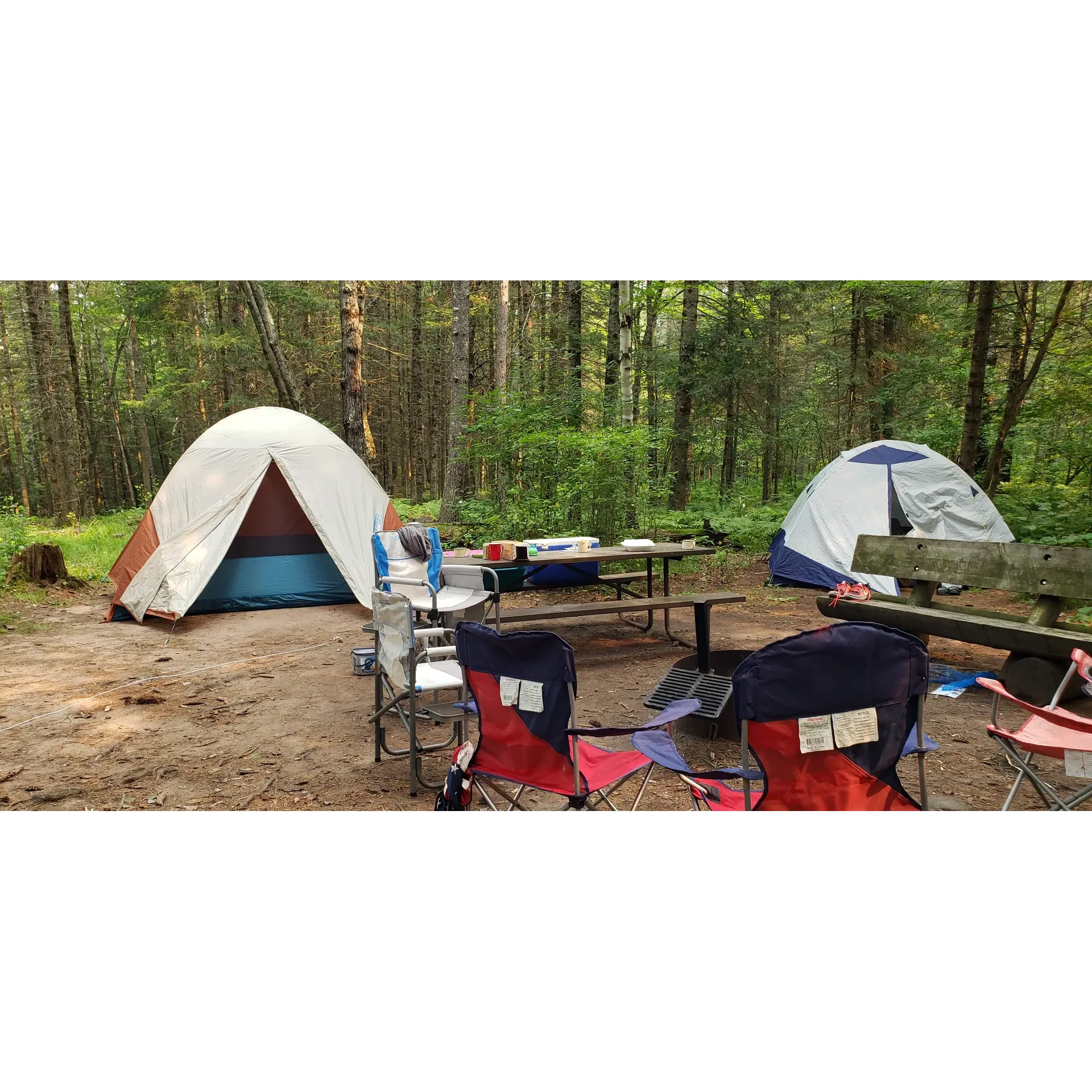 Bois Brule Campground offers outdoor enthusiasts an exceptional camping experience in the serene beauty of a pine forest along the majestic Brule River. Renowned as one of the premier campgrounds, it provides the perfect blend of tranquility and outdoor adventure.

With well-maintained and level sites, each camping spot comes equipped with fire rings, cooking grates, picnic tables, and a rustic bench, creating a cozy setting for campfire gatherings. The cleanliness and convenience extend to the very modern pit toilets, ensuring comfort for all guests.

The campground boasts a delightful picnic area by the river, complete with tables, grills, and a unique fire ring with benches. The serene riverside location is complemented by the added amenity of a canoe landing, which includes a viewing platform ideal for fishing or simply basking in the scenic beauty of the river.

Water enthusiasts will appreciate the immediate river access for embarking on memorable canoeing and kayaking adventures. Fascinating trails beckon hikers of all levels, with the proximity to the North Country National Scenic Trail, providing the perfect backdrop for exploration.

Service remains a cornerstone of the campground experience, with friendly personnel at the nearby ranger station and an artesian well head for fresh water. For those seeking a quiet retreat, selected sites offer an exclusive riverbank location, immersing campers in the natural splendor of the region.

The allure of Bois Brule Campground is further heightened by its accessible distance from top attractions, including Lake Superior, adding diverse options for day excursions. Its reputation as a peaceful retreat, combined with its idyllic setting, makes it a sought-after destination—encouraging advance reservations to secure a spot in this outdoor paradise. Description by ChatGPT.