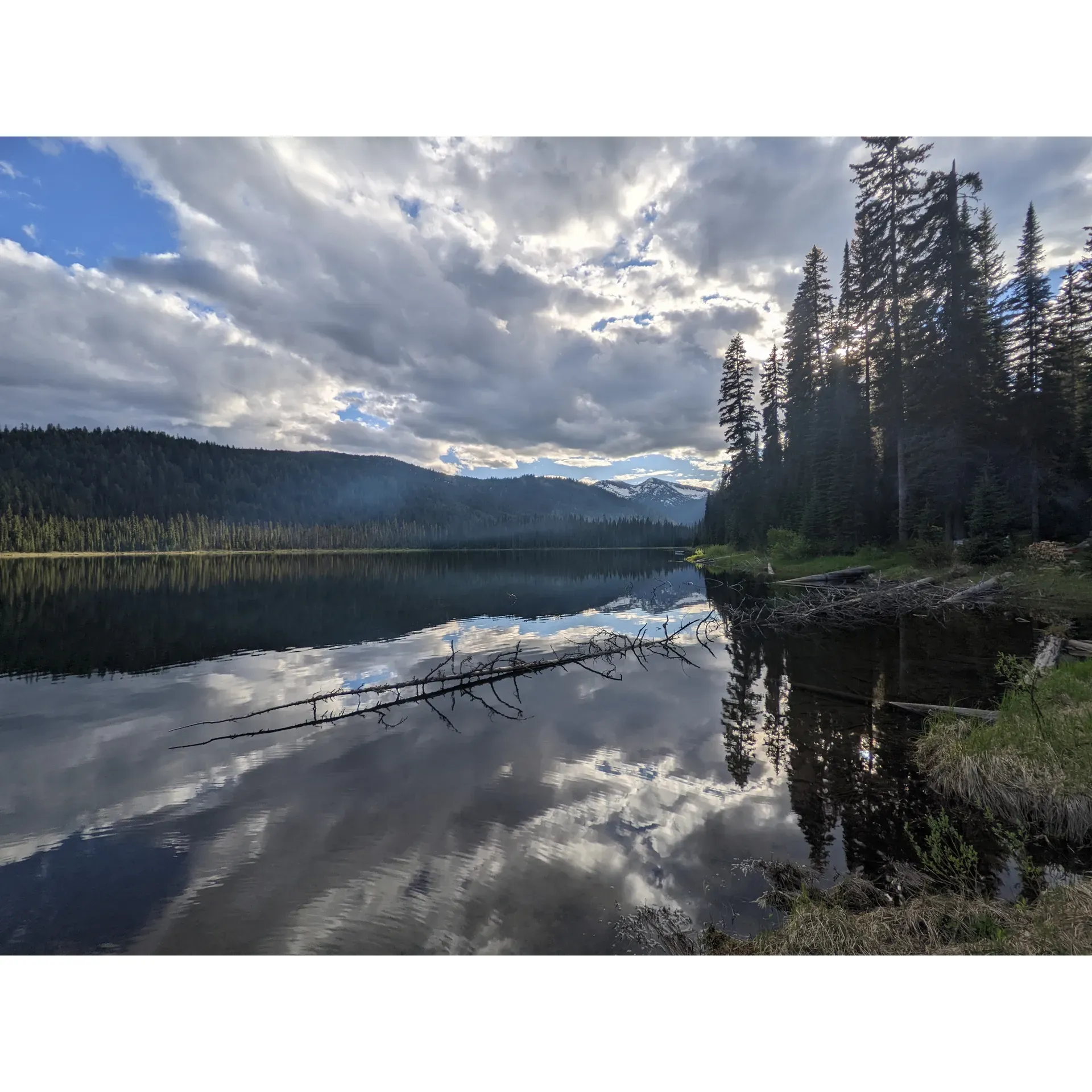 Boundary Lake Recreation Site in Creston boasts an inviting array of outdoor experiences for those seeking a delightful retreat into nature's embrace. The picturesque campground provides an array of sites, with some offering lakeside views and convenient docks, appealing to both privacy-seekers and water enthusiasts alike. Visitors looking to immerse themselves in serene surroundings will find the location a perfect spot for setting up camp amid the gentle whispers of wilderness.

The crystalline lake itself is a gem for swimmers and paddle boarders, offering tranquil waters that beckon adventurers to dive in and explore. Anglers, too, will feel at home here, as glimpses of fish leaping from the lake promise an exciting catch on return visits with rods in hand.

Access to Boundary Lake Recreation Eye unfolds on an 18km drive from the highway, along a gravel road that's easily navigable by car. Those arriving by small trailer will find the cartop boat launch perfectly suited for seamless entry into the water, opening up opportunities for kayaking and canoeing adventures. The site's surrounding landscapes also cater to hikers, presenting a selection of trails that promise discovery at every turn.

Tucked away from the bustle, this gem of a destination remains relatively undiscovered, providing ample space and peace for visitors even during the peak seasons. It's a place where tranquility reigns, allowing guests to indulge in the simple pleasures of nature without the distractions of a crowded environment. Whether seeking a quiet getaway or an active day on the lake, Boundary Lake Recreation Site is a choice spot to relax and revel in the great outdoors. Description by ChatGPT.