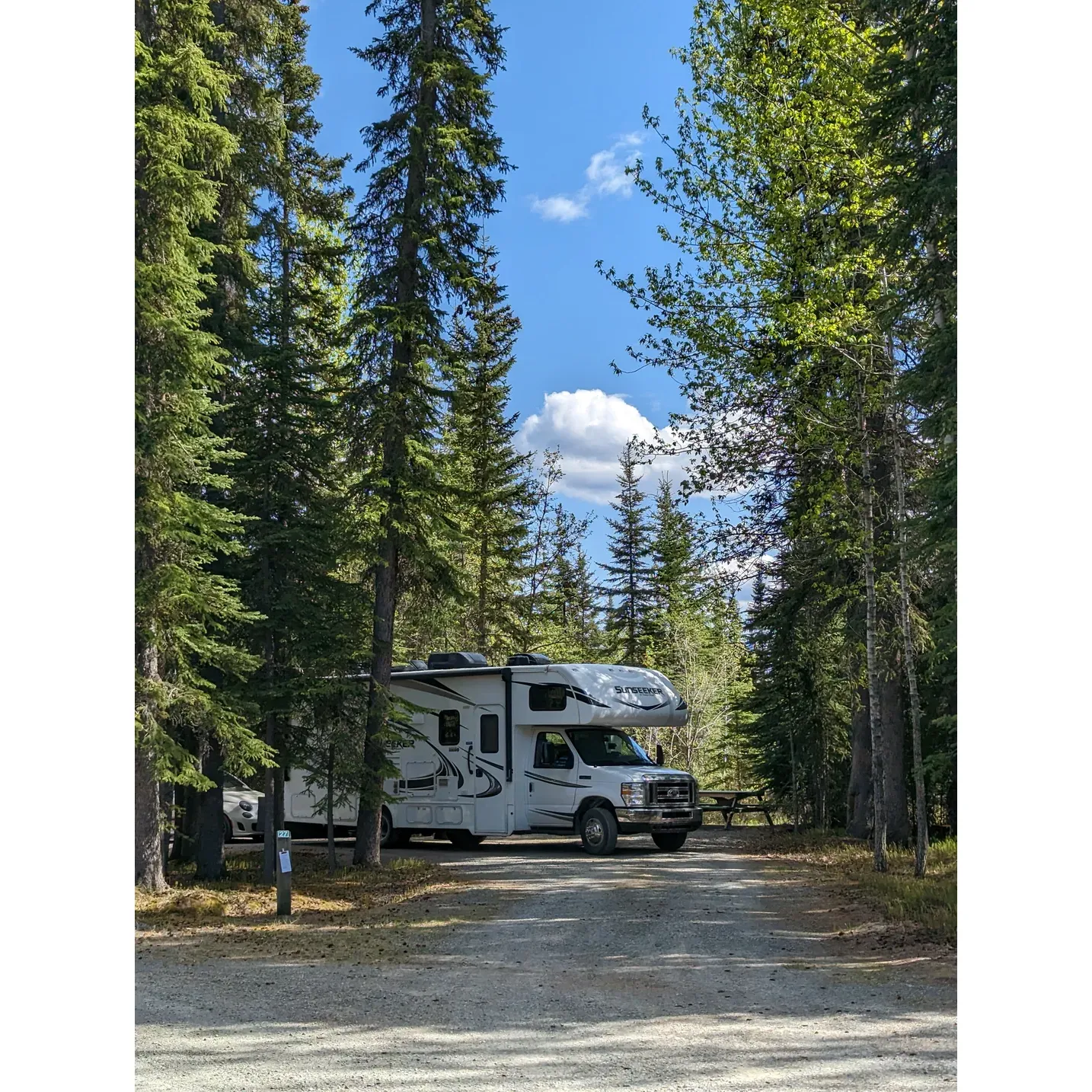 Discover the serene tranquility of Lake Creek Campground, a scenic hideaway that offers visitors a harmonious blend of privacy and natural beauty. This small but picturesque campground is known for its spacious and well-separated campsites, providing ample room for peace and seclusion amidst the wilderness. Guests frequently find themselves enveloped in a quiet so profound that they can enjoy the exclusive experience of being the sole campers during their stay.

Visitors consistently praise the cleanliness of the facility, highlighting well-maintained bathrooms that ensure comfort and hygiene throughout their outdoor adventure. An added amenity that not only delights but also brings warmth to your camping experience is the complimentary firewood, ensuring that your stay is cozy and that a crackling fire is always within reach.

Lake Creek Campground offers a perfectly placed stop for those journeying along the Alaska Highway in the Yukon Territory, presenting both splendid mountain vistas and alluring river views that capture the picturesque beauty of the surrounding landscape. Whether you need a restful break from your travels or a charming spot to spend the night, you'll find this campground to be a well-serviced oasis along your route.

With convenient features like pull-thru sites that cater to a streamlined set-up for campers and the presence of a vault toilet nearby, the campground is both practical and user-friendly. Moreover, the affordability of the site, typically around $20 CD, ensures that your stay is not only pleasant and peaceful but also budget-friendly.

Lake Creek Campground stands out as an impeccable choice for those seeking a clean, quiet, and inviting outdoor retreat where the embrace of nature comes with a promise of unmatched tranquility and comfort. Description by ChatGPT.