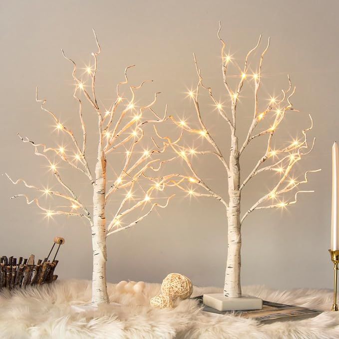 The Vanthylit White Birch Tree with LED Lights is a set of 2 artificial trees designed for indoor use. Each tree stands at 2 feet tall and is illuminated by 24 warm white LED lights, creating a cozy and festive ambiance in any room.