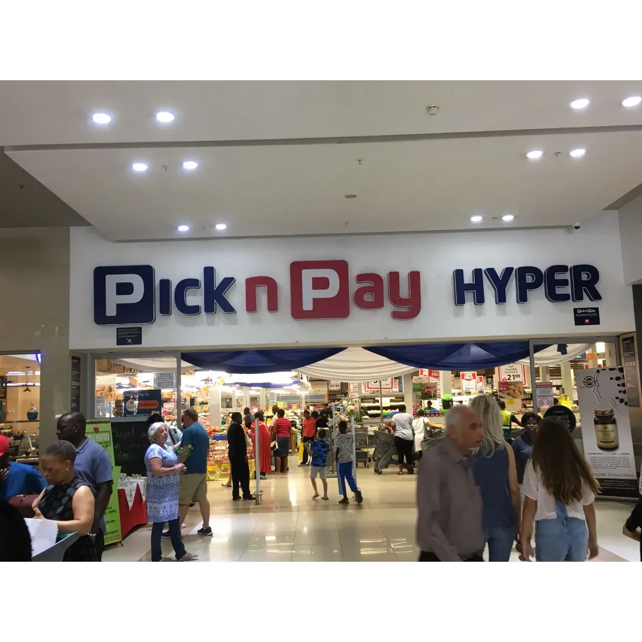 Pick n Pay Hyper Norwood offers a vibrant and welcoming shopping destination to all visitors seeking a comprehensive and fresh selection of products. The store prides itself on delivering exceptional customer service, making each shopping trip a pleasant and friendly experience. The ambiance within the mall contributes to the overall positive atmosphere that shoppers enjoy.

A standout feature of the store is its impressive variety of fresh produce. The vegetable section is particularly noteworthy, earning accolades for offering a diverse range of high-quality, crisp produce to meet all your healthy living needs. Meat lovers and those with a taste for baked goods will also find a satisfying selection, with the meat department and bakery presenting choice cuts and delightful baked creations to elevate any meal.

The layout of the store is designed for customer convenience, with a variety of till points to facilitate a smooth checkout process. Among these, dedicated express tills and tills for the elderly show a commitment to serving all customers with respect and efficiency.

With its great location, Pick n Pay Hyper Norwood continues to be a go-to retail destination, committed to providing fresh, quality products and aiming to ensure a shopping experience that makes customers look forward to their next visit. Description by ChatGPT.