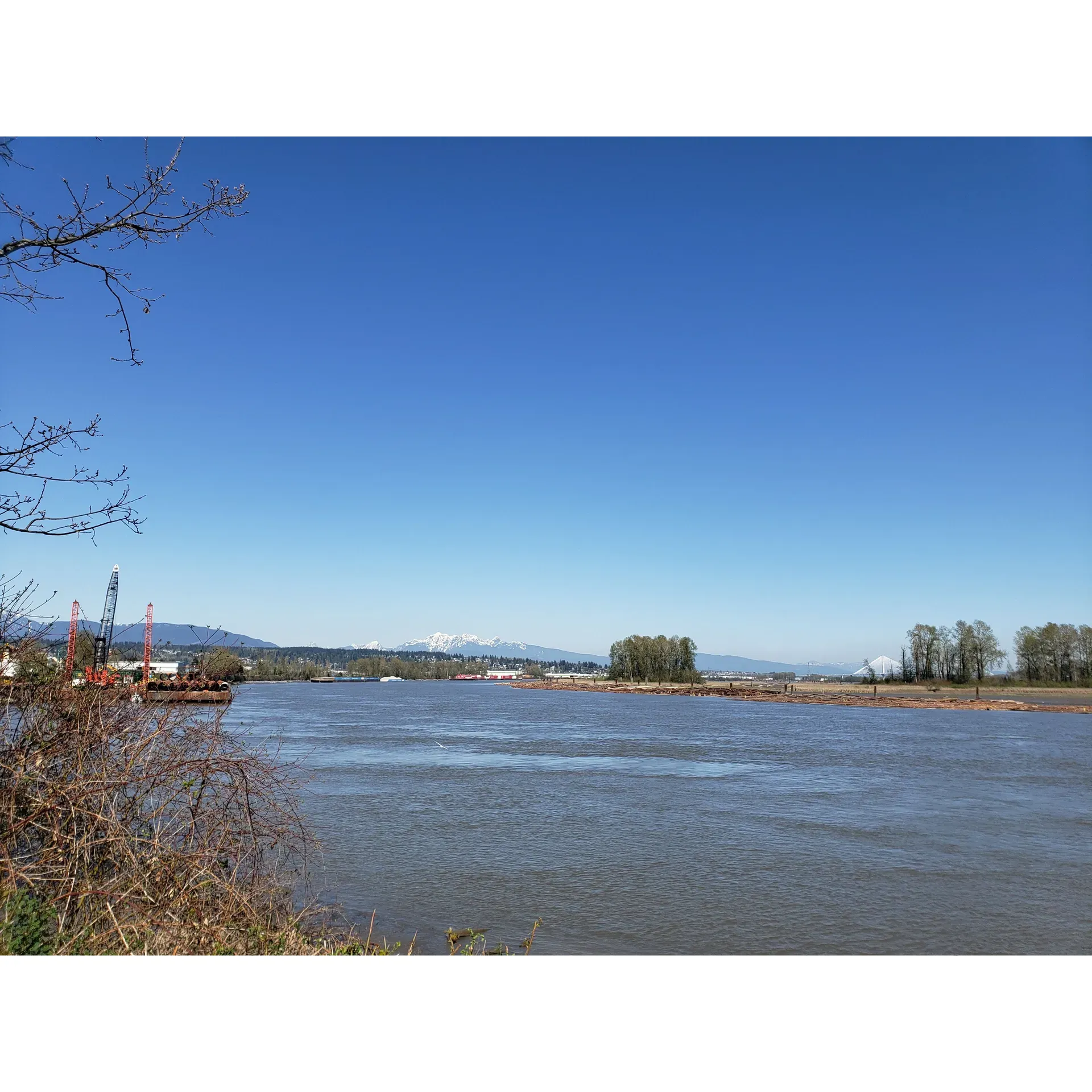 Sapperton Landing Park offers a serene escape for both reflective solitude and family-friendly recreation along the picturesque waterfront. Perched by the riverside, it invites visitors to immerse themselves in the stunning scenery, with well-maintained walkways that meander beside the flowing water, providing a peaceful backdrop for contemplation or a leisurely stroll.

Ideal for daily visits, the park has become a popular spot for locals seeking to unwind and engage in personal reflections. The tranquil environment, occasionally graced by the sight of playful otters, offers the kind of solace and introspection that can ignite a sense of determination and renewed purpose.

Families find joy in the park's amenities, particularly during sunny days when the picnic gazebo becomes a hub of shared meals and laughter. While in proximity to the urban hum, children delight in the wonder of passing trains, turning an otherwise ordinary outing into an exciting spectacle amidst nature.

Cyclists and pedestrians alike appreciate the park's integration into the Brunette-Fraser Greenway, boasting a regional bike path that invites visitors to explore the area on two wheels. The availability of street parking in the nearby neighborhood and three parking spots close to the park entrance adds convenience for all guests.

The park's commitment to upkeep is evident in the newly constructed washroom facilities that offer cleanliness and comfort, although the lighting system is designed for efficiency. With its flat, paved paths, Sapperton Landing is not only accessible for strollers and bikers but also welcoming to canine companions, as long as they are on a leash.

Visitors can recline at various resting spots, engage with the local wildlife, or simply admire the ebb and flow of the river's currents. While the entrance from Columbia Street requires some caution due to traffic, once inside, the park becomes a tranquil haven conducive to meditation, picnics, or an invigorating cycle. Regardless of the season, Sapperton Landing Park stands as an inviting destination for anyone looking to find a moment of peace or an enjoyable day out in the beauty of nature. Description by ChatGPT.