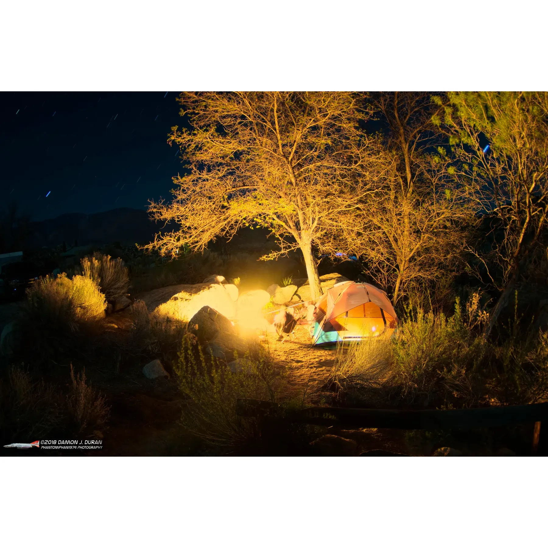 Lone Pine Campground is a serene sanctuary designed for avid campers and outdoor enthusiasts. With 43 well-maintained sites, this campground offers a blend of tranquil privacy and communal charm. Its prime location at the foot of the majestic Mt. Whitney ensures breathtaking views and easy access to the area's natural wonders.

Camping enthusiasts regularly commend the walk-in sites at the upper end of the campground for their idyllic setting and extra touch of solitude. Each site is equipped with a bear box to protect your food and belongings, while providing ample shade and privacy for a comfortable outdoor living experience. The presence of numerous trees throughout the campground contributes to the shady retreats, perfect for relaxation and connecting with nature.

The soothing sounds of the nearby creek enhance the ambiance and provide a peaceful backdrop for a restful sleep under the stars. Strategically placed water outlets and trash bins make the camping experience convenient, maintaining the pristine environment of the campground.

Those with a love for exploration can take advantage of the historic trail to Whitney Portal. Stretching four miles and ascending through picturesque landscapes, this trail gives adventurers a taste of the bygone era's route to the trailhead, a journey made even more enjoyable by the lush surroundings and potential for wildlife sightings.

Visitors also appreciate the exceptional cleanliness and freshness of the facility's restrooms. In addition, the campground's community is known for its friendliness, welcoming fellow campers and creating an atmosphere of good neighborliness.

Culinary enthusiasts can take a short drive up to Whitney Portal, where they can immerse themselves in some of the best pancakes the region has to offer. Furthermore, maintaining a spotless environment, the camp host diligently ensures top-notch sanitation, particularly for the well-kept vault toilets.

Lone Pine Campground's landscape is adorned with an array of trees, brush, and greenery, offering seclusion between the campsites, while also providing pleasant shady spots to ward off the desert sun. Campers have the option to pitch tents or park their RVs, with the assurance that facilities, such as water and trash disposal, are easily accessible.

With a prime spot by the river, campers are treated to the gentle lullaby of flowing water at night. The proximity to the Mount Whitney Portal Trailhead, especially for those at the walk-up sites, means an incredible hiking experience awaits just steps away. The trail is a visual feast, following the river with stunning waterfalls and unforgettable views en route to Whitney Portal.

Overall, Lone Pine Campground is the exemplar of a pristine, well-managed outdoor escape offering both the thrills of adventure and a peaceful retreat amidst spectacular scenery. Whether seeking a challenging hike, an inviting community, or a quiet nook to rejuvenate, this campground promises unforgettable experiences and beckons visitors to return time and again. Description by ChatGPT.