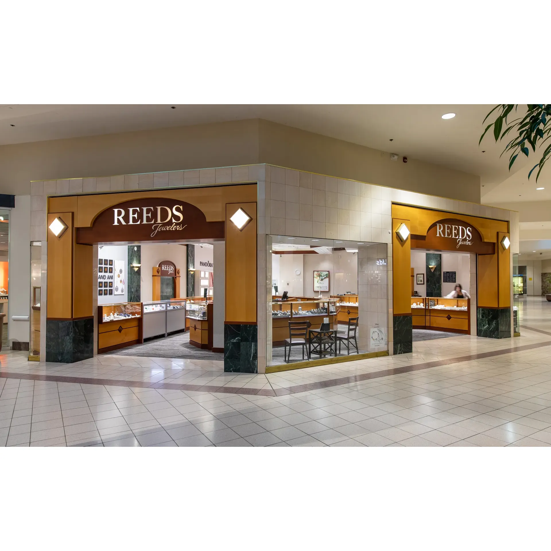 REEDS Jewelers is a treasure trove for those in search of fine jewelry and exceptional customer service. A beacon of excellence in the jewelry industry, REEDS caters to a variety of clients, from those looking for intricate and customizable pieces to those in need of the perfect accessory to complement a cherished item. Their selection exceeds expectations, offering sterling silver necklace chains with fine details like small catches, precisely meeting the needs of customers like Sylvia Polliard, enabling them to revive the sentimental value of personal heirlooms.

The dedicated staff, including Bernadette, embody patience and attentiveness, ensuring that each customer finds their ideal piece even if it requires trying on numerous options. This commitment to offering a personalized shopping experience is reminiscent of a bygone era where customer service was paramount. Moreover, the availability of extended warranties on their merchandise solidifies customer confidence and satisfaction.

For those seeking unique personalization, REEDS shines through with its bespoke services. Mildred stands out as an exemplary consultant, guiding customers through the process to bring their vision to life, crafting one-of-a-kind items that resonate with sentimental significance. This capability to transform customer desires into tangible realities fosters an emotional connection that extends beyond the purchase.

The amiable staff, including the effervescent Juju, further enhances the REEDS experience. Their friendly demeanor and expertise ensure that customers feel valued and have an enjoyable shopping journey, even evoking a sense of playful indulgence that leaves a lasting impression.

Above all, REEDS provides financial solutions to their clients, offering credit approvals that might seem unattainable elsewhere. This financial flexibility, coupled with the staff's dedication and the store's extensive product range, cements REEDS Jewelers as a distinguished destination for those seeking quality jewelry and a trusted retail experience. Customers leave not only with exquisite pieces but also with heartfelt appreciation for the superior service and the assurance of a high-caliber establishment. Description by ChatGPT.