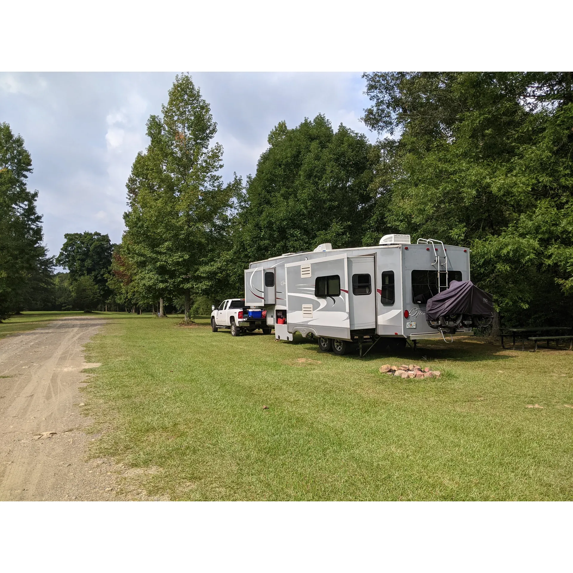 Escape to the great outdoors at the Chief Ladiga Trail Campground, a picturesque oasis offering a tranquil and authentic camping experience. This serene destination is a paradise for nature lovers, providing a sprawling landscape that ensures plenty of space and privacy for an intimate encounter with the wilderness.

The campground delights visitors with its impressive scenery and undisturbed peace, allowing one to fully immerse in the natural beauty that surrounds. The vastness of the area means that guests can enjoy their own slice of the outdoors without the feeling of crowding, maintaining an atmosphere of solitude and relaxation.

Catering to the needs of the modern camper, the campground boasts a well-maintained bathhouse that is frequently celebrated for its cleanliness. Featuring tiled shower stalls, campers can refresh and unwind after a day full of adventure. The bathhouse is a welcome comfort in the rustic setting, ensuring a comfortable and rejuvenating stay.

For those seeking a no-frills camping trip, Chief Ladiga Trail Campground offers a primitive camping style, encouraging guests to fully engage with the environment. While amenities like dump stations and RV hookups are not available, the trade-off comes in the form of undisturbed natural ambiance and simple pleasures, such as listening to the soothing sounds of wildlife and the gentle flow of the nearby creek.

Stargazers and nocturnal adventurers will revel in the remote location, far from the glare of city lights, allowing for superb stargazing on clear evenings. The campground's seclusion also contributes to the exceptionally quiet atmosphere, perfect for a peaceful sleep under the stars.

Adventure-seekers will appreciate the convenient access to the renowned Chief Ladiga bicycle trail, which runs along the backside of the property. This feature makes the campground an ideal stop for cyclists and outdoor enthusiasts wanting to explore the scenic path.

Recognized for its commitment to upkeep and hospitality, the campground pleases guests with its cleanliness and friendly atmosphere. A reliable bathhouse with showers and fresh water enhances the comfort of your stay.

Chief Ladigan Trail Campground stands out as a recommended destination for those looking to disconnect, savor the quiet beauty of nature, and create memorable outdoor experiences. Returning guests and newcomers alike are drawn to this enchanting retreat, eager to indulge in the simplicity and splendor of camping in one of the region's most lovely settings. Description by ChatGPT.