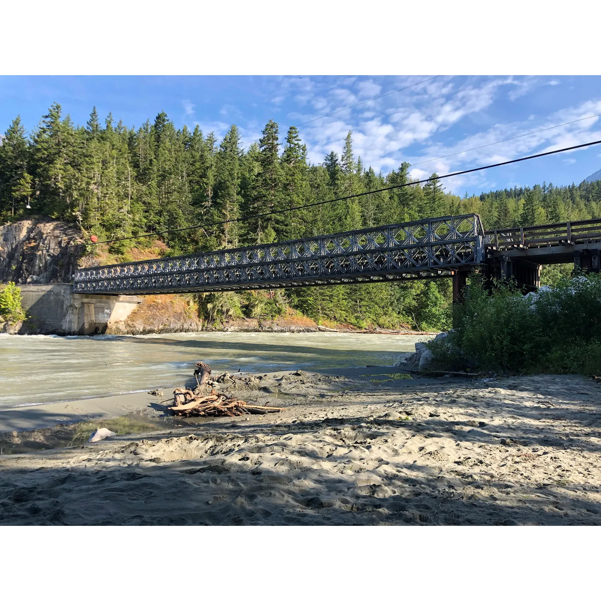 Bailey Bridge Campsites is a tranquil and picturesque destination for outdoor enthusiasts looking for a blend of rustic charm and convenience. The campsite offers a safe haven with spacious sites, surrounded by the natural beauty of a rapid and vibrant river, complemented by a lovely small beach ideal for fishing or a courageous swim. With a commitment to cleanliness and relaxation, guests can enjoy well-lit outhouses, treated water, and the serene atmosphere of the great outdoors.

Visitors can choose from over 20 campsites and a selection of cozy cabins, all equipped with electricity, and varying amenities such as kitchen essentials and comfortable bedding arrangements. Essential services like firewood are offered at a very reasonable price to enhance the camping experience. The facilities proudly include clean coin-operated showers and laundry, ensuring a touch of luxury during your wilderness adventure.

The new ownership has continued the campsite's legacy of excellence, with friendly hosts that are attentive and resourceful. Whether it's accommodating booking changes or offering fishing guidance, the remarkable service contributes to the fond memories guests create year after year. The campsite hosts, Keith and Bob, go above and beyond to ensure a delightful stay, keeping their guests informed on local fishing tips, techniques, and gear available at the on-site supply shop.

Bailey Bridge Campsites also provides a sense of seclusion from the digital world, offering limited internet service to encourage guests to immerse themselves in the scenic beauty and reconnect with nature. The site's coin-operated laundry facilities and availability of treated water are added conveniences that make this exceptional camping destination feel like a true home away from home.

For those looking to revel in the great outdoors without foregoing modern comforts, this campsite strikes the perfect balance. Whether it's for an overnight stay or an extended holiday, Bailey Bridge Campsites invites nature lovers to indulge in a unique and unforgettable escape by the majestic Bella Coola river. Description by ChatGPT.