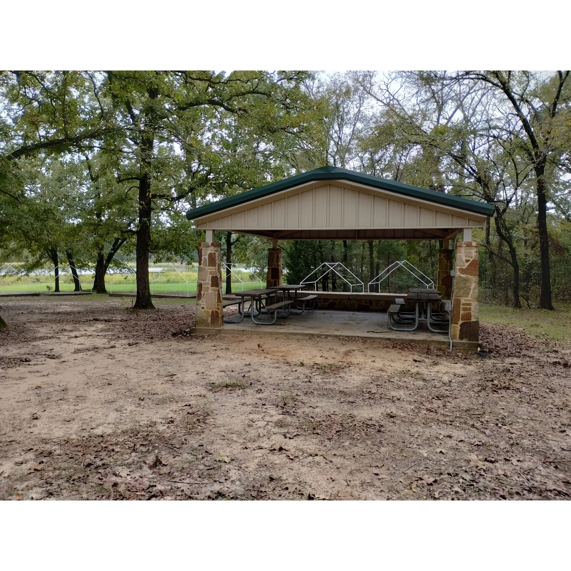 Elm Flats Camp Site is a serene outdoor haven, ideal for both the adventurous soul and the peace seeker. This picturesque campsite is beautifully maintained and offers a harmonious blend of natural features, from the grassy expanses that offer a soft bed for tents to the subtle sand/clay mix that reminds you of the natural terrain beneath your feet. 

Anglers will appreciate the convenience of the bridge connecting Elm Flats to the Cypress Knee campground, providing an easy passageway to prime fishing spots where one can enjoy tranquility by the water's edge. The campsite is thoughtfully designed with handy amenities, including two sheltered pavilions perfect for group gatherings or protection from the elements. 

The inclusion of a flagpole adds to the sense of community and pride among campers, marking a spot where one can observe the time-honored tradition of raising the flag. Elevated latrine facilities ensure that even during heavy rains, convenience and hygiene are never compromised.

Elm Flats Camp Site truly embodies the spirit of the outdoors and is an exemplary choice for Boy Scouts looking to immerse themselves in nature, all under the watchful eye of an iconic and friendly staff. The campsite's impeccable care and the inspiring surroundings make it an unforgettable retreat that many regard as a slice of paradise. Description by ChatGPT.