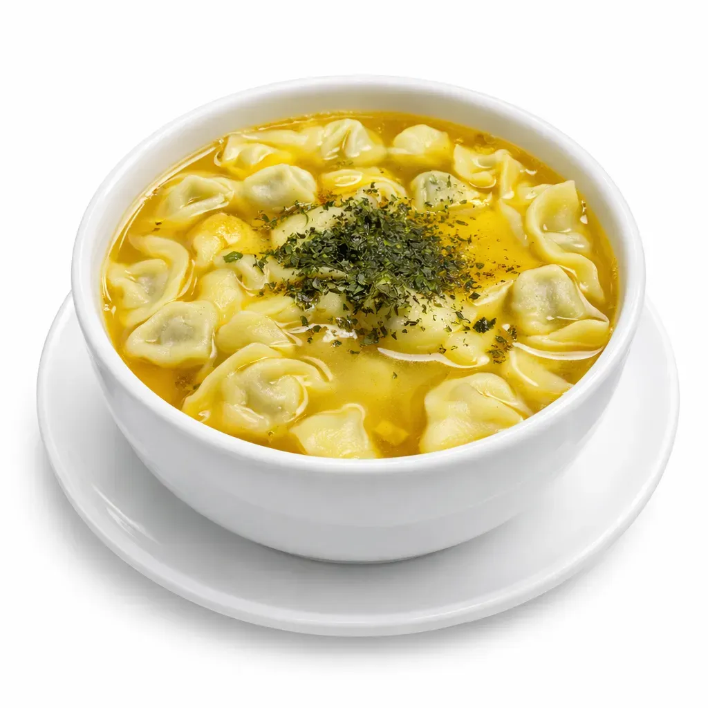 A cherished traditional Azerbaijani soup featuring delicate, meat-filled dumplings in a savory tomato-butter broth.
