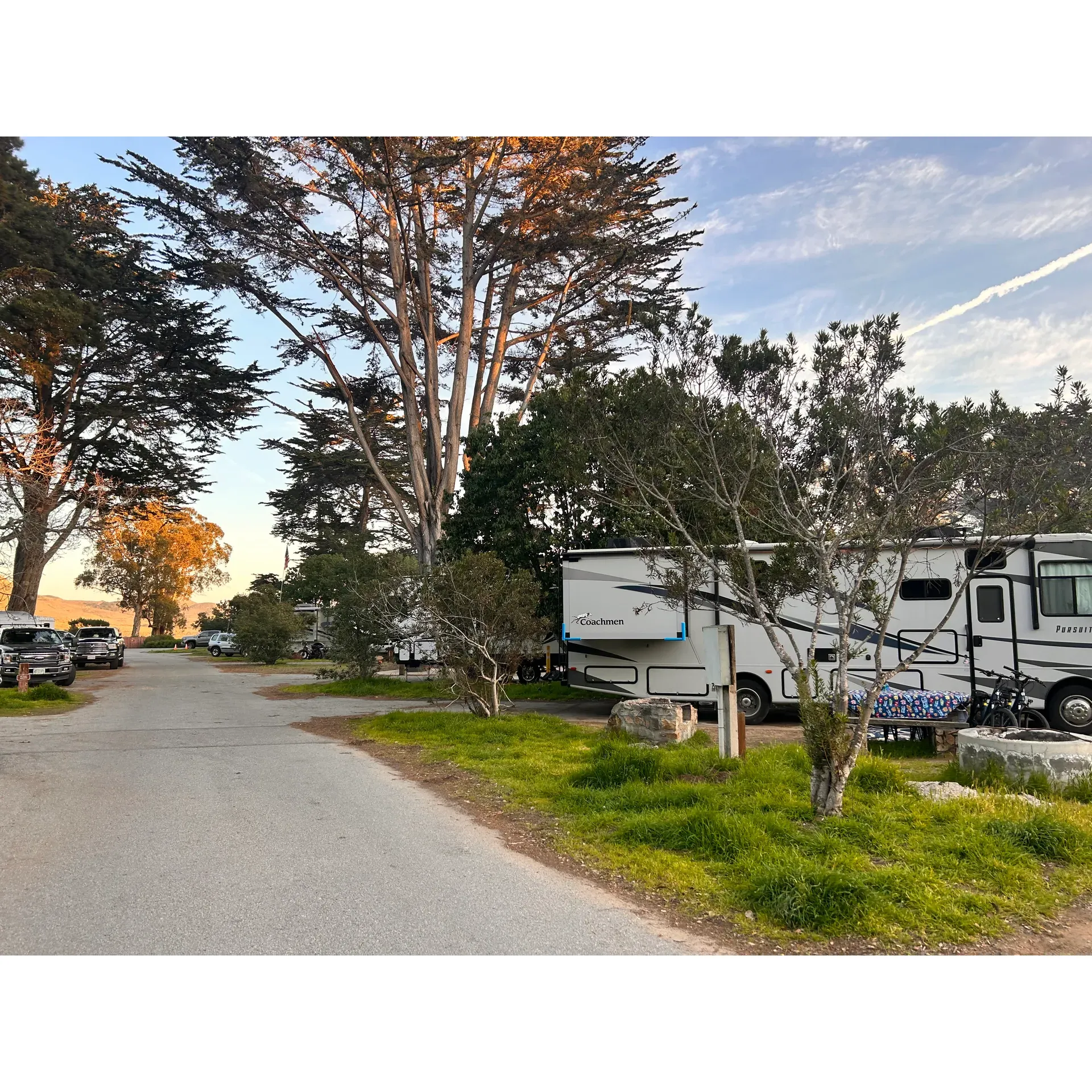 Morro Bay State Park Campground is an idyllic outdoor retreat, revered for its convenience and proximity to the scenic beauty of Morro Bay and the iconic Highway 1. Travelers looking to explore this captivating coastal area find the campground to be perfectly situated for a variety of adventures.

The meticulously maintained campground boasts level sites, ensuring easy setup and stability for both tents and trailers. Avid campers often highlight the clean and well-kept restrooms and showers, reflecting the campground's commitment to a high standard of cleanliness.

For those looking to enjoy evenings by the campfire, firewood is readily available for sale, adding to the serene ambiance of the park. The soothing shade provided by mature trees offers a cool retreat, while its adjacency to a lovely golf course appeals to those looking to enjoy a round of golf amidst their outdoor experience.

Regular visitors, including those journeying from distant locations such as Sacramento, find Morro Bay State Park Campground well worth the trip, with the area's fun atmosphere and stunning views offering ample reward for the commute. The availability of power and water hookup sites adds convenience for trailers and RVs, featuring excellent accessibility to the location's spectrum of activities.

First-time visitors, especially those new to travel trailer camping, appreciate the campground's cleanliness and close vicinity to grocery stores and other amenities. The provision of a dump station and water fill station make it simple to manage the practical aspects of camping.

The campground is enveloped by magnificent trees, which although providing splendid shade, may be a consideration for those relying on solar charging, and advanced booking is advised due to the campground's popularity. The experience of camping at Morro Bay State Park is further enhanced by its clean and friendly facilities, token-operated showers, abundant hiking opportunities, proximity to a charming downtown area rich in antique shops and restaurants, and a museum laden with interesting finds.

Above all, the resplendent natural surroundings, well-appointed sites offering a sense of privacy, decent showers, and personable staff come together to create a simply beautiful camping experience right across from the allure of the ocean. Description by ChatGPT.