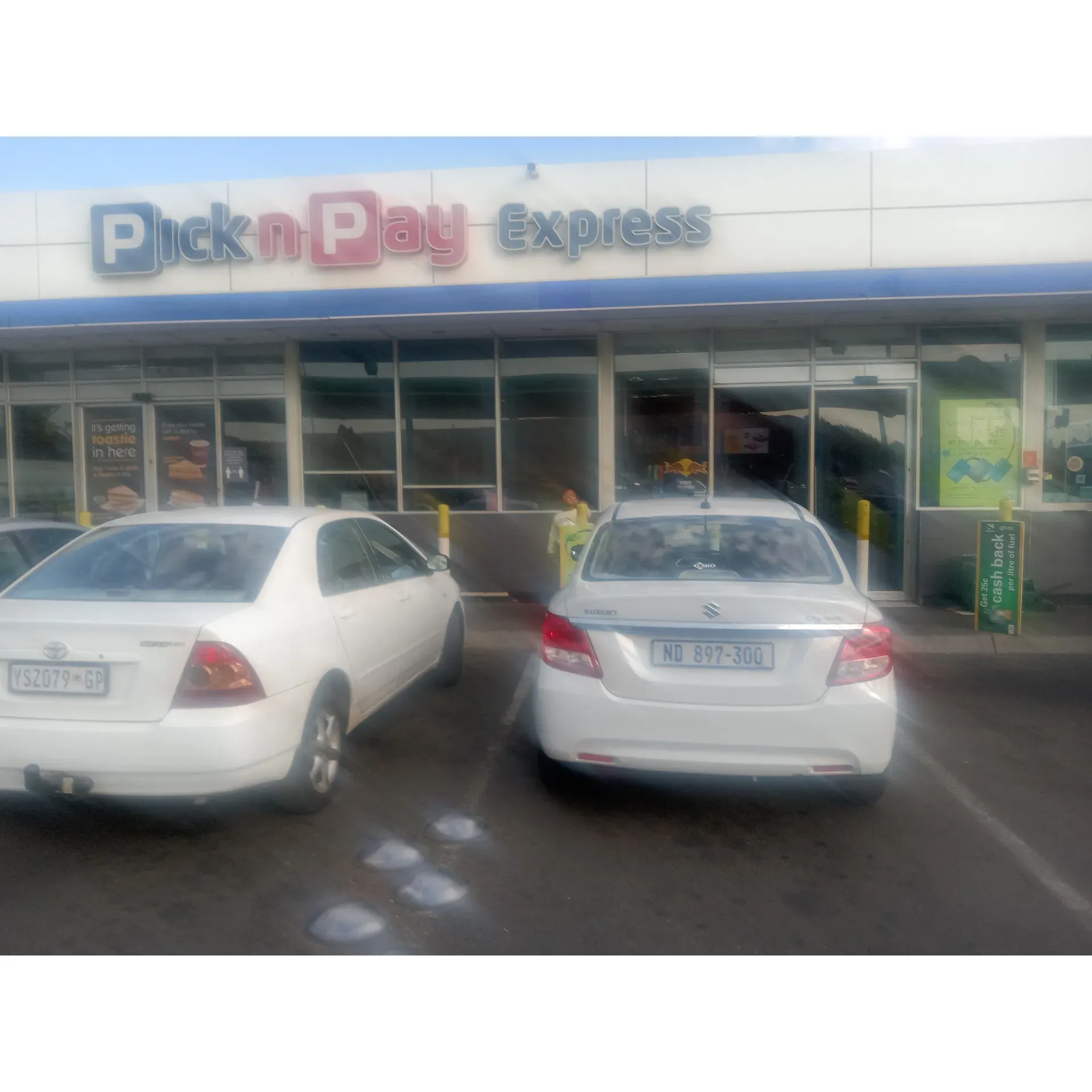 Pick n Pay Express provides a convenient shopping solution for those who prefer a quick and easy alternative to visiting larger stores. This express branch is highly regarded for addressing the needs of customers who are on the go, offering a range of quality products and services in a compact, friendly environment.

The staff at Pick n Pay Express are frequently praised for their pleasant demeanor and willingness to assist. Shoppers appreciate the attentive service provided, which enhances the overall shopping experience. The focus on customer assistance is a cornerstone of the store's ethos, ensuring that each visit is as smooth and satisfactory as possible.

In addition to the positive shopping environment, the store has made noticeable improvements in service areas such as the petrol station, where patrons have recognized a significant enhancement from previous experiences. This commitment to elevating service levels demonstrates the store's dedication to meeting and surpassing customer expectations.

Moreover, the store boasts a range of fresh, high-quality offerings at the food deli, providing shoppers with tasty and convenient meal options during their busy days. Pick n Pay Express aims to maintain a high standard of service across all its departments, striving to deliver an efficient and positive experience for all of its customers. Description by ChatGPT.