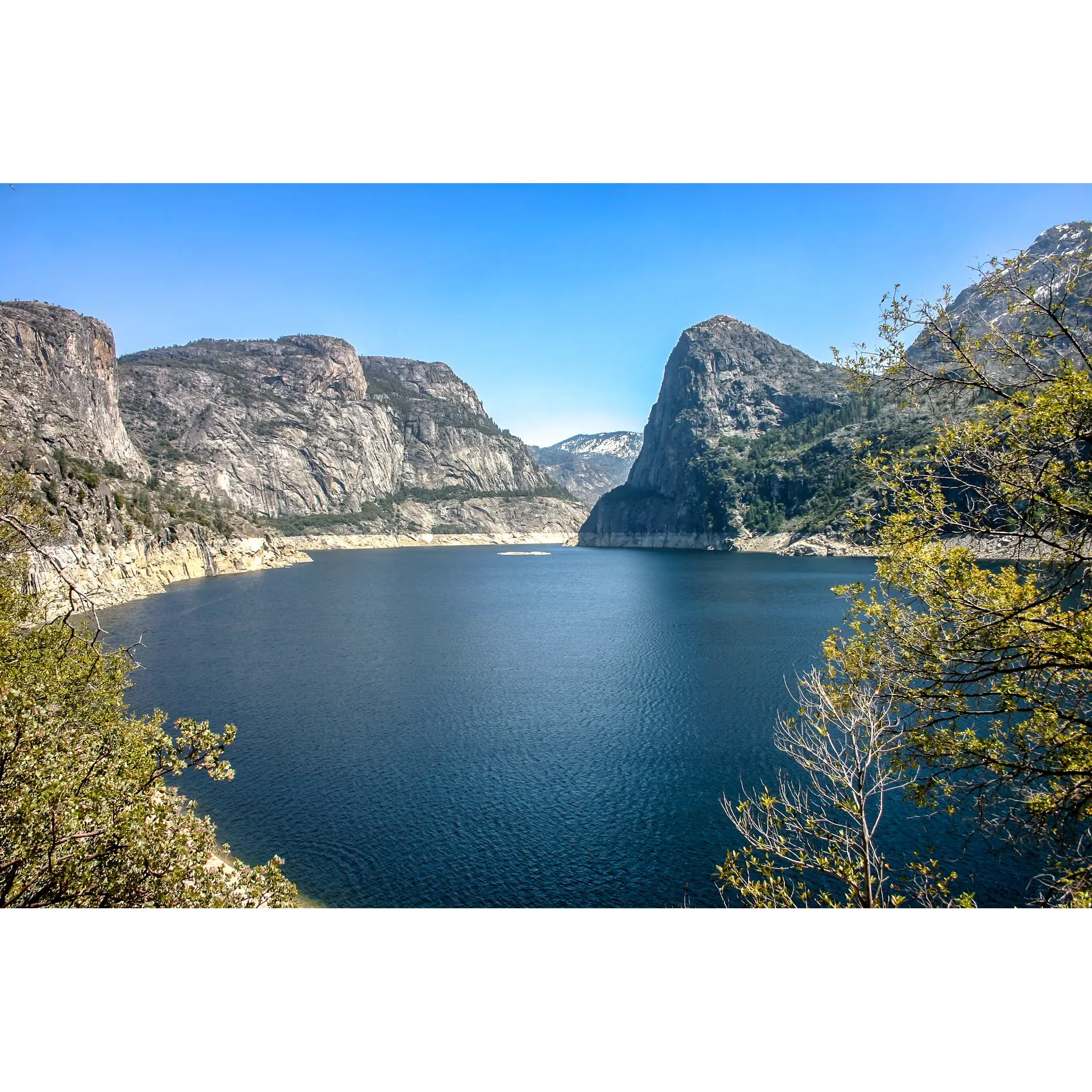 Discover the charm of the great outdoors at Hetch Hetchy Backpackers Campground, a tranquil paradise that attracts nature enthusiasts looking for an authentic wilderness experience away from the bustle of peak tourist seasons. Ideally visited in the early spring, when nature awakens and the waterfalls cascade with magnificence, the campground invites adventurers to a memorable journey amidst the splendors of nature.

Access to this serene retreat is effortless, with a drive that allows you to appreciate the surrounding beauty at your own pace. Embrace the opportunity to detach from the common trails and find peace in a site that, during the mid-summer months, becomes an exclusive haven for campers seeking a personal connection with the environment.

An array of activities awaits avid explorers, including hikes to breathtaking waterfalls and backpack treks to pristine lakes, all enveloped in an ambiance of tranquility and natural grandeur. Visitors are encouraged to preserve the cleanliness and safety of this beautiful ecosystem, maintaining its pristine condition for the wildlife that calls it home and for future generations of nature lovers.

Families find the Hetch Hetchy Backpackers Campground an enriching place full of natural wonders and opportunities to learn about the area's rich history and its vital link to faraway places like San Francisco. While the journey here is a scenic adventure of its own, it's the spirit of discovery and education that leaves a lasting impression on both young and old.

For photographers and hikers, the campground offers a visually captivating landscape and challenging treks that reward visitors with unparalleled scenic vistas. However, be prepared for an authentic backpacking excursion, as the camping experience begins with an invigorating four-mile hike — a true testament to the wilderness ethos the campground upholds.

With its limited accessibility, designed to preserve its untouched beauty, the Hetch Hetchy Backpackers Campground stands as a treasured destination for those yearning to immerse themselves in the tranquility of the great outdoors. Here, you can forge lasting memories and find respite in the embrace of nature's masterpiece. Description by ChatGPT.