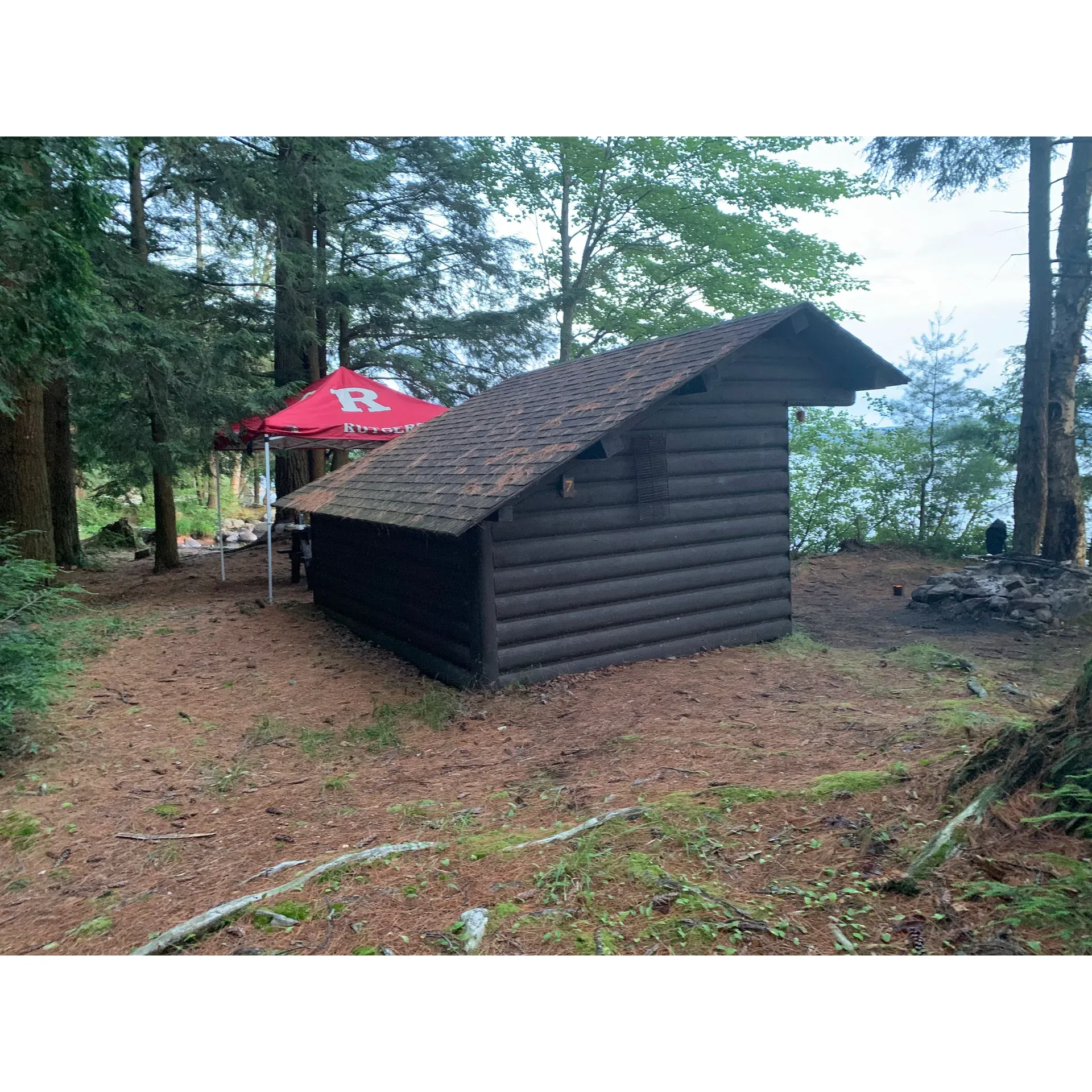 Tioga Point Campground's Lean-To Site #7 offers an idyllic outdoor experience for campers seeking a balance of rustic charm and comfortable cover in the great outdoors. This particular site has garnered positive comments for its inviting atmosphere and the quality of shelter it provides to guests looking to immerse themselves in nature without forgoing the coziness of a well-structured camping spot.

The lean-to structure at Site #7 is thoughtfully designed to enhance your camping adventure, providing a sturdy and reliable haven that stands ready to welcome you after a day of exploration or relaxation amidst the serene surroundings. Visitors who have had the opportunity to compare different sites appreciate the subtle nuances that make Site #7 a great choice, with its advantageous positioning offering both convenience and an enjoyable camping experience.

Campers also have the opportunity to explore nearby sites, such as #8 and #6, with each offering their unique characteristics. However, the consistent high regard for Site #7 among past guests is a testament to the well-rounded experience it offers. With its combination of good cover and a warm, friendly atmosphere, it's a premier selection for those looking to tap into the beauty of Tioga Point Campground. Whether you're settling in for a peaceful retreat or gearing up for outdoor activities, Lean-To Site #7 is a memorable destination for your camping journey. Description by ChatGPT.