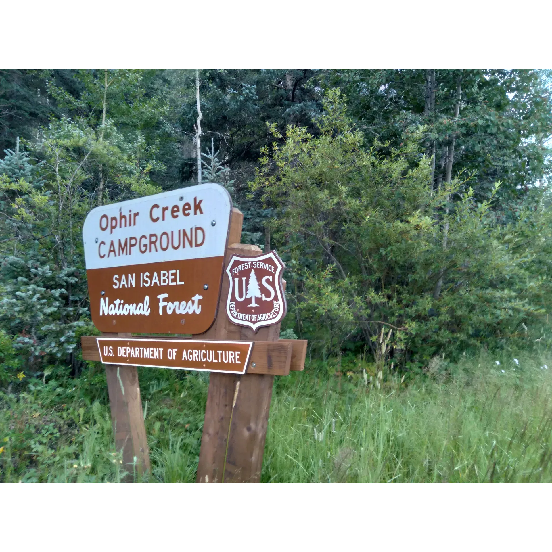 Ophir Creek Campground offers outdoor enthusiasts an idyllic haven for adventure and relaxation. Guests are greeted with the serene ambiance of a flowing creek, creating a tranquil soundtrack to their stay. The pristine condition of the expansive camping sites, complete with picnic tables and fire pits, is regularly noted and appreciated by visitors. Camp hosts at this haven receive frequent praise for their friendly and welcoming demeanor, ensuring a hospitable experience for all who arrive.

Nature lovers will delight in the convenience of having a wealth of natural beauty at their fingertips, including a stunning waterfall located a short hike away. The cascade provides not only a picturesque backdrop but also an exciting destination for those looking to explore the surroundings. For families, this trek is a thrilling challenge, offering rewarding views and a sense of accomplishment upon reaching the falls.

The proximity of Ophir Creek Campground to local attractions like Bishops Castle and Lake Isabel enhances its appeal. These nearby sights make for delightful day trips and are easily accessible from the campgrounds. The area's untouched beauty is a treasure trove for outdoor activities, with plenty of trails inviting campers to venture into the woods and discover the natural wonders.

Guests also have peace of mind thanks to thoughtful amenities such as bear boxes, ensuring a safe and worry-free outdoor experience. The frequent availability of firewood in the vicinity is another boon for those who love to spend their evenings around a cozy campfire under the stars.

Furthermore, the campground is acknowledged for its spaciousness, offering sites that accommodate a wide range of camping styles, be it tent camping, RV hook-ups, or more secluded spots in the surrounding forest. The spotless restroom facilities receive regular commendations, demonstrating a commitment to comfort and cleanliness.

With its attentive staff, remarkable natural features, and excellent facilities, Ophir Creek Campground stands out as a premier destination for both seasoned campers and newcomers alike, all for a value that enhances the overall experience. It's a locale that invites repeated visits, where each stay promises treasured memories and the joy of the great outdoors. Description by ChatGPT.