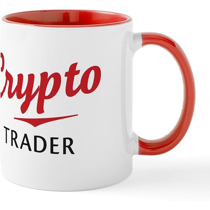 The CafePress Crypto Trader Mug is a 11 oz (325 ml) ceramic coffee mug designed for cryptocurrency enthusiasts and traders. Made from high-quality ceramic material, this mug is durable and ideal for daily use. It features a glossy finish and a comfortable C-shaped handle for easy gripping.