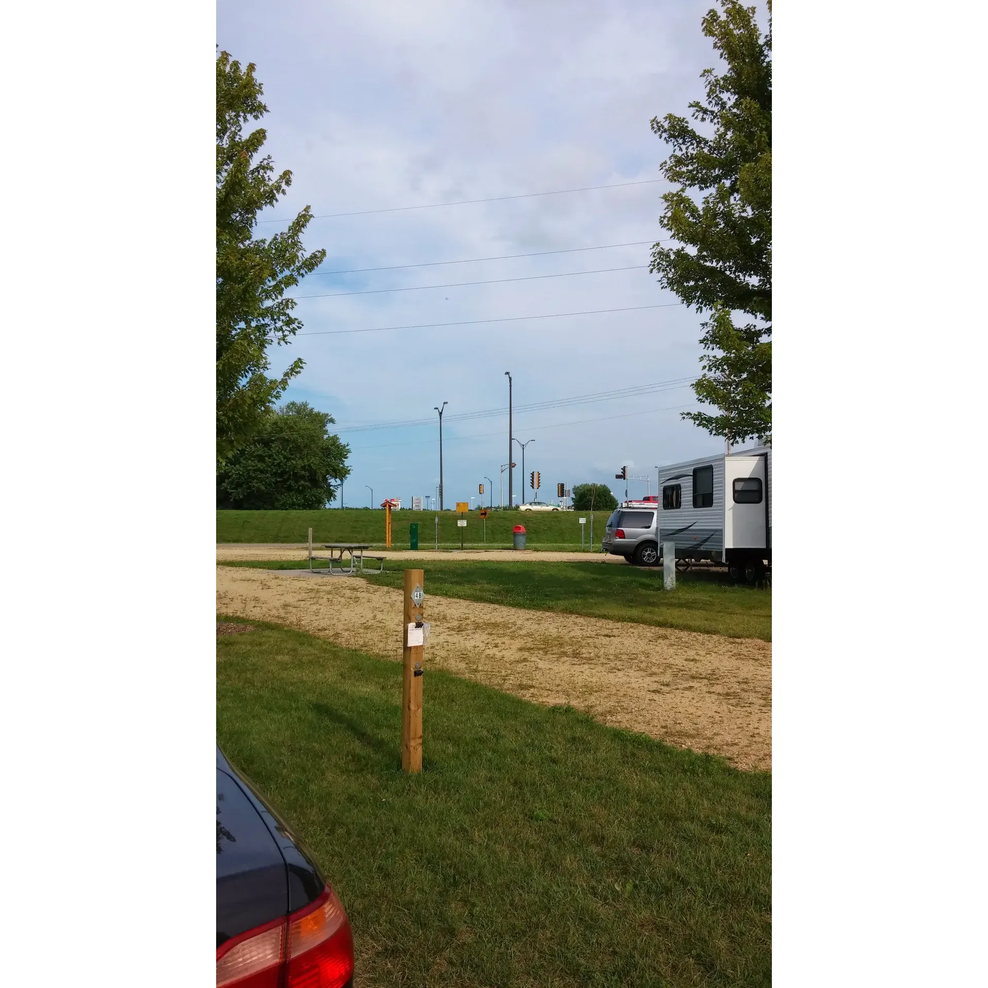 Hatfield Park Campground offers a serene retreat for campers looking for a convenient escape from the hustle and bustle of city life without venturing too far from modern conveniences. The campground's prime location on the edge of town provides direct access to a scenic bike trail that meanders through the adjacent city park and sports field, creating a perfect loop around the town for those who enjoy outdoor activities.

Visitors to Hatfield Park Campground are greeted with a well-maintained array of full hookup sites, allowing for a comfortable and hassle-free stay. Whether you're passing through for a night or setting up camp for an extended getaway, the campground accommodates with both pull-through and back-in sites to suit a variety of RVs and camping setups.

The management's commitment to guest satisfaction shines through, with numerous reviews praising the helpful and accommodating nature of the staff, particularly Maria, who is known to go the extra mile to ensure a pleasant experience for every visitor.

Long-term campers have expressed appreciation for the campground's noteworthy affordability, coupled with essential services such as reliable water and electric hookups. Additional conveniences like a dump station ensure that all camping needs are met with ease, contributing to the overall appeal of Hatfield Park Campground.

While the campground itself maintains a focus on simplicity, this very quality enhances its charm and attracts guests who prefer the unadulterated essence of camping. Despite the lack of additional amenities such as showers or camp offices, the surrounding park facilities offer a variety of recreational options, including baseball fields, a small playground, lake access from a modest dock, a skate park, and ample greenery for picnics or leisurely strolls.

Cyber-savvy campers can benefit from free Wi-Fi access, although it's worth noting that connectivity may vary during different times of the day. Regardless, the service provides the necessary link to the digital world for guests who require it.

For those needing to venture out for supplies, Hatfield Park Campground is conveniently located near local stores, including the much-loved ACE hardware store nearby, all while providing an easy escape back to the tranquility of the campground.

In summary, Hatfield Park Campground presents a no-frills yet utterly satisfying camping experience, combining the joys of outdoor living with the ease of accessibility to town amenities, all wrapped up in a welcoming atmosphere praised by many who have chosen to stay. Description by ChatGPT.