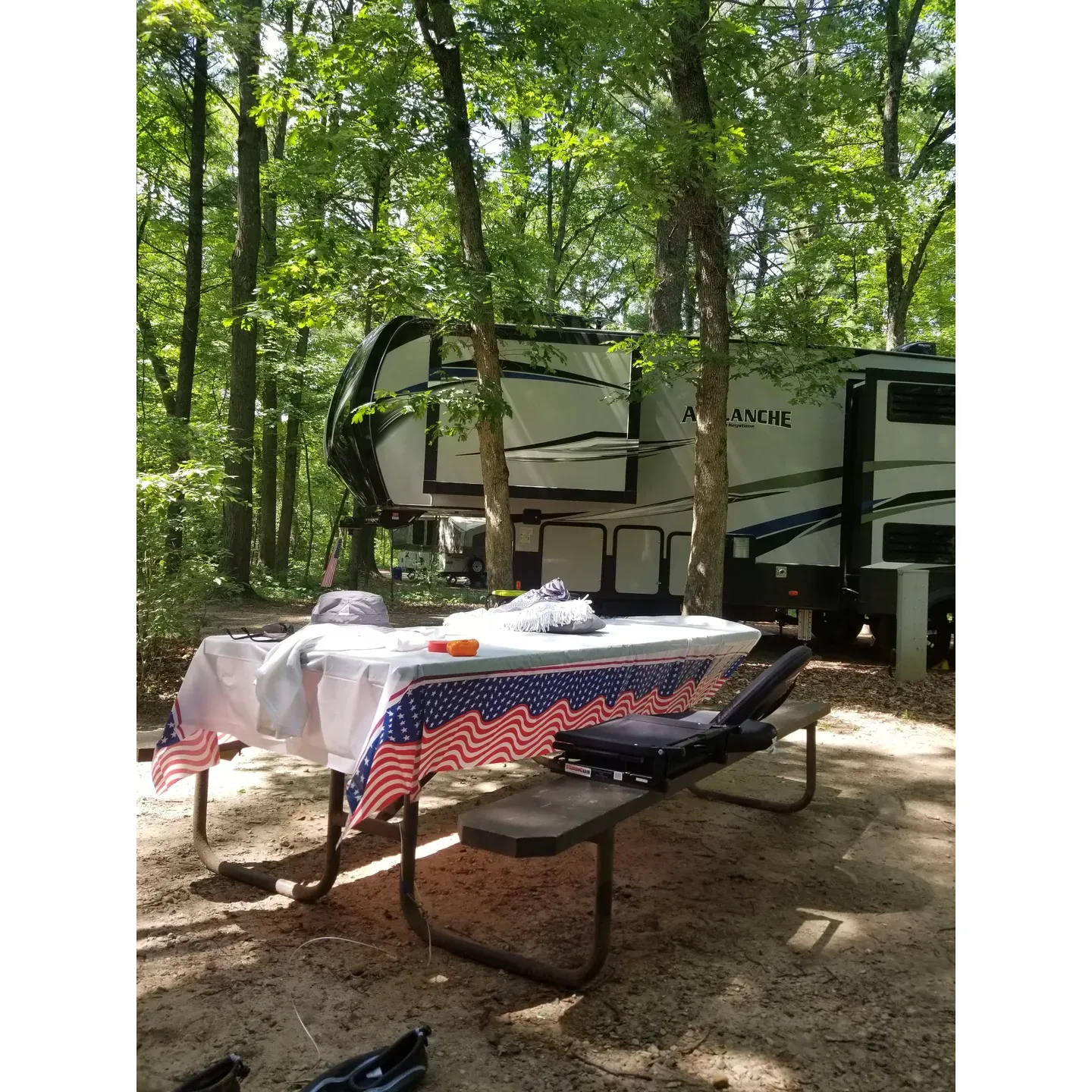 Sandstone Ridge Campground, an alluring destination, makes its mark as one of the top 5 camps in Wisconsin State Parks with its welcoming expanse and commitment to providing an exceptional outdoor experience. The campground offers a uniquely private and serene section, particularly the 67-72 loop, ensuring that guests can enjoy nature's tranquility. Campers can immerse themselves in the beauty of the surrounding wilderness, taking advantage of the excellent hiking trails that showcase the natural allure of the area.

Kayaking enthusiasts will find Sandstone Ridge Campground a prime location to paddle and explore, with ample opportunities for water adventures. The site also serves as a convenient launchpad to discover a bevy of local tourist attractions, promising an engaging stay for everyone.

Guests will appreciate the generous size of the campsites, which cater to larger groups with ease, allowing space for multiple vehicles and tents. Visitors can find solace in secluded spots like Site 98, which pairs solitude with convenient facilities, including a nearby shower building and a thoughtful layout that addresses the natural elements.

Additional amenities enhancing the camping experience include well-maintained, gender-specific shower facilities for the north side's power sites, and upgraded flushable toilets and showers servicing the south side's non-powered sites. While the area is a hub for kayaking and boasts beautiful trails, tent campers will also find the electrical spots accommodating, even with the absence of designated tent pads.

The campground is pet-friendly, inviting campers to enjoy the great outdoors alongside their canine companions, respecting the park's guidelines. Connectivity is catered to, with sufficient cellular service to meet your data and streaming needs, though the lush woodland setting may limit satellite connectivity, keeping you intimately connected to nature.

For those interested in Laborday bookings or peak season visits, proactive reservation is advised due to the campground's popularity, hinting at the allure of its quieter atmosphere compared to bustling tourist centers nearby. Friendly hosts enhance the experience, ensuring guests feel valued and well-cared for during their stay.

As an environmentally conscious retreat, Sandstone Ridge Campground balances accessibility, recreation, and comfort, culminating in a memorable and enjoyable camping trip. With thoughtful touches including available firewood and a consideration for the finer details of camping life, it's a destination where nature's peace is only a campfire away. Happy camping! Description by ChatGPT.