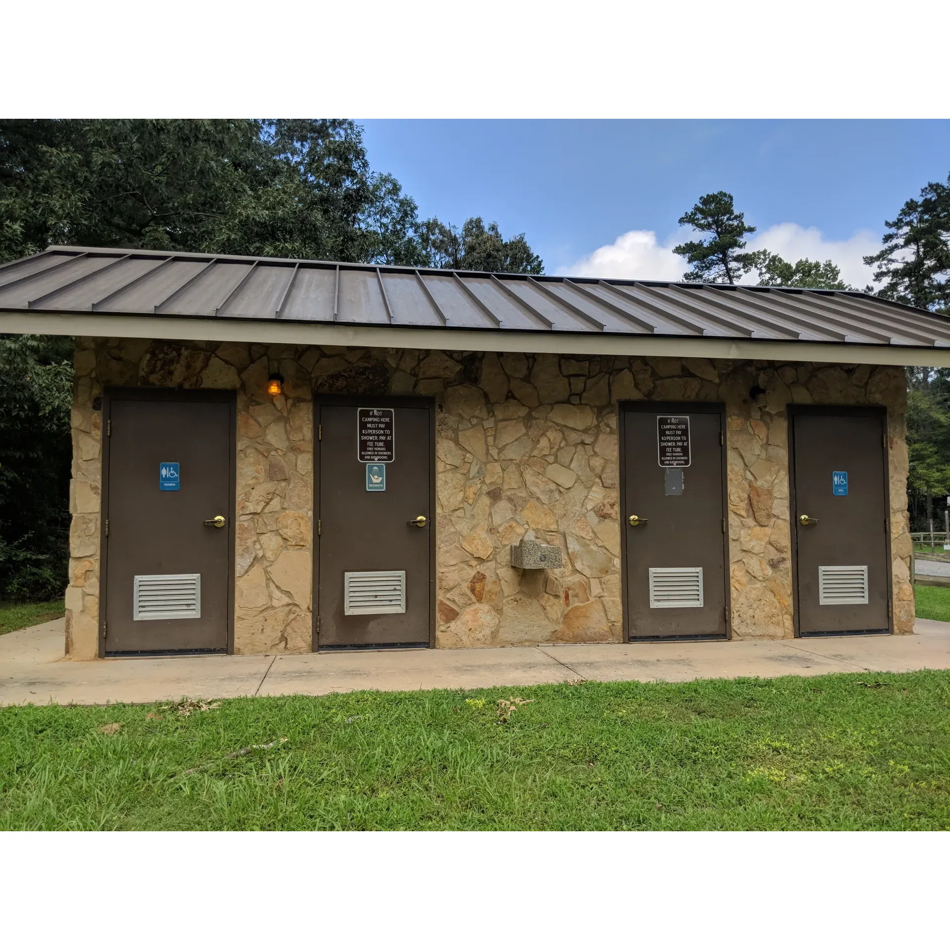 Canebrake Horse Camp offers an excellent outdoor experience for equestrian enthusiasts, with well-maintained, level, and graveled sites that are perfect for both RVs and horse trailers. Each camping spot is thoughtfully equipped with robust high-tie stantion posts, ensuring that horses are comfortably and securely accommodated.

The camp prides itself on providing ample amenities for all visitors. This includes the convenience of two full bathrooms, each with separate and fully private shower rooms, enhancing the comfort and privacy for guests during their stay.

Set within the exquisite and relatively undiscovered expanse of a beautiful national forest, Canebrake Horse Camp is a serene getaway that allows visitors to immerse themselves in nature while having access to modern facilities. Campers with equine companions will appreciate the well thought out sites, which include fire pits, hooks, and tack tables for their use.

The campsite offers abundant space, ensuring that even during full capacity weekends, the atmosphere remains peaceful and relaxing. Throughout the week, tranquility previces, providing an excellent balance for those seeking quietude or socialization with other horse lovers.

Outdoor enthusiasts will find themselves spoiled with numerous trails winding through the forest, perfect for explorative rides and creating memorable experiences. The natural surroundings boast a thriving wildlife scene, where encounters with graceful deer are not uncommon, often seen enjoying the leftover grains from their equine neighbors.

A dedicated and accommodating camp host is available to assist guests with their needs, enhancing the community feel of the campsite and ensuring that all visitors have a pleasant and enjoyable stay.

Whether you're looking for a spot to rest during a long journey or seeking an idyllic location for a longer sojourn, Canebrake Horse Camp promises a delightful retreat for RV campers and horseback riders alike, making it an ideal choice for your next outdoor adventure. Description by ChatGPT.