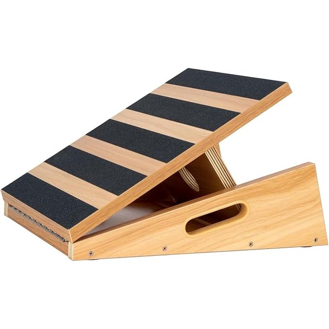 The StrongTek Professional Wooden Slant Board is a versatile tool designed to assist with stretching exercises, particularly for the lower legs. It is commonly used to enhance flexibility, relieve muscle tension, and improve posture by providing a stable platform for calf stretches and various physical therapy exercises.