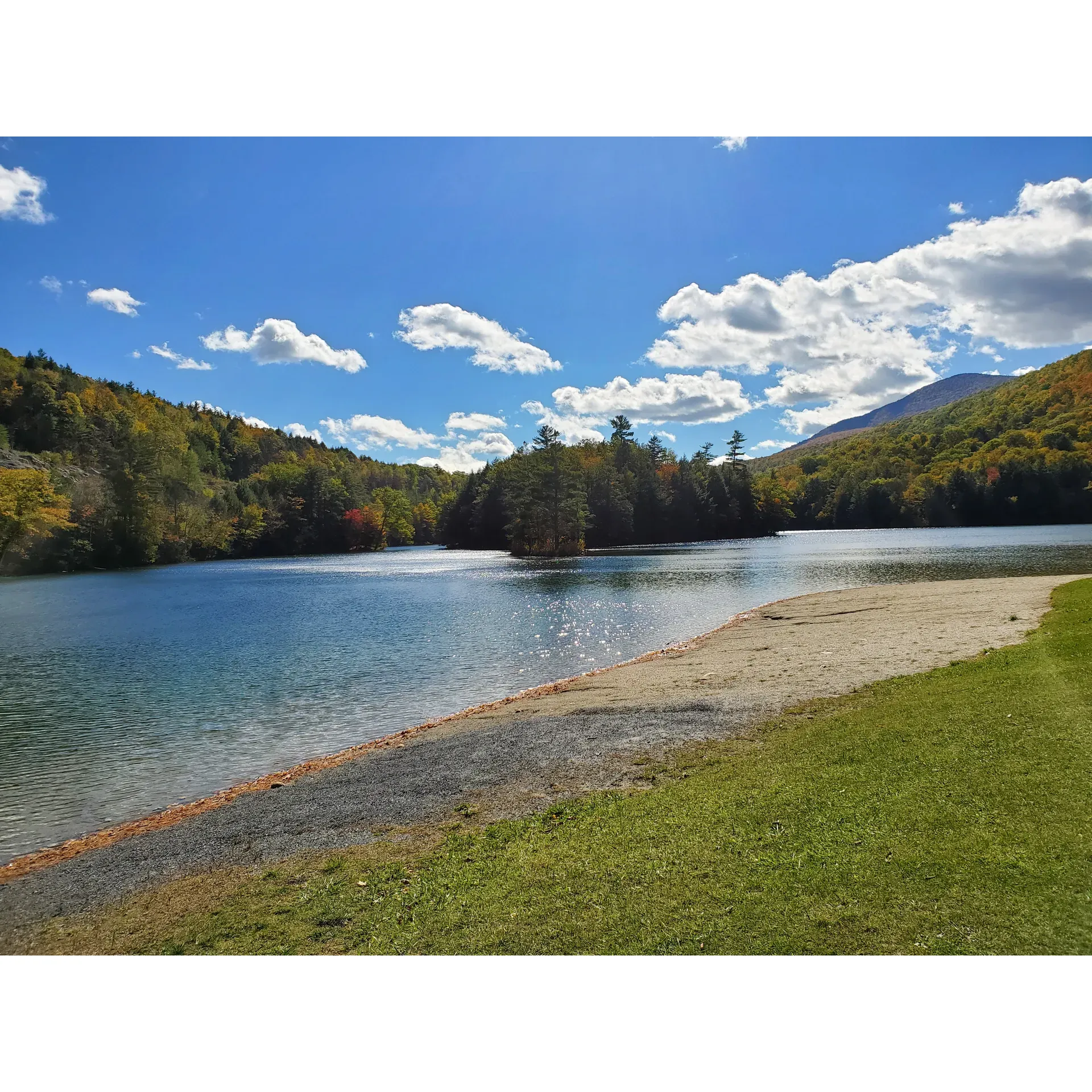 Emerald Lake State Park is a picturesque outdoor destination in Vermont, beloved for its stunning emerald-green waters and serene ambiance. This marvelous state park is an ideal spot for visitors who enjoy the great outdoors, especially those who delight in aquatic activities on a vibrant, crystal-clear lake perfect for a refreshing plunge or a leisurely paddle.

The park's well-maintained trails invite nature enthusiasts to meander along the scenic shoreline, where the eye-catching clarity of the lake makes it possible to spot fish gliding through the water. An abundance of greenery ensures a peaceful walk, where every step offers a new appreciation for the park's natural beauty.

Campers are treated to spacious campsites that offer privacy and a sense of being in one's own woodland retreat. With the gentle sounds of nature providing a tranquil soundscape, each site is a welcoming space for relaxation and reconnection with nature. The park maintains clean facilities, including restrooms, to add to the comfort of its guests.

Exceptionally friendly and dedicated staff work tirelessly to keep Emerald Lake State Park a pristine and inviting locale. Their efforts in preserving the park's natural state while ensuring cleanliness are evident and contribute greatly to the overall experience.

Visitors can also revel in the delightful beach area and indulge in a nature walk that exemplifies the beauty of Vermont's landscapes. Whether it's time spent on the sand, on the trails, or simply soaking in the picturesque surroundings, Emerald Lake State Park is a cherished escape that beckons adventurers and peace-seekers alike to enjoy its captivating charm season after season. Description by ChatGPT.