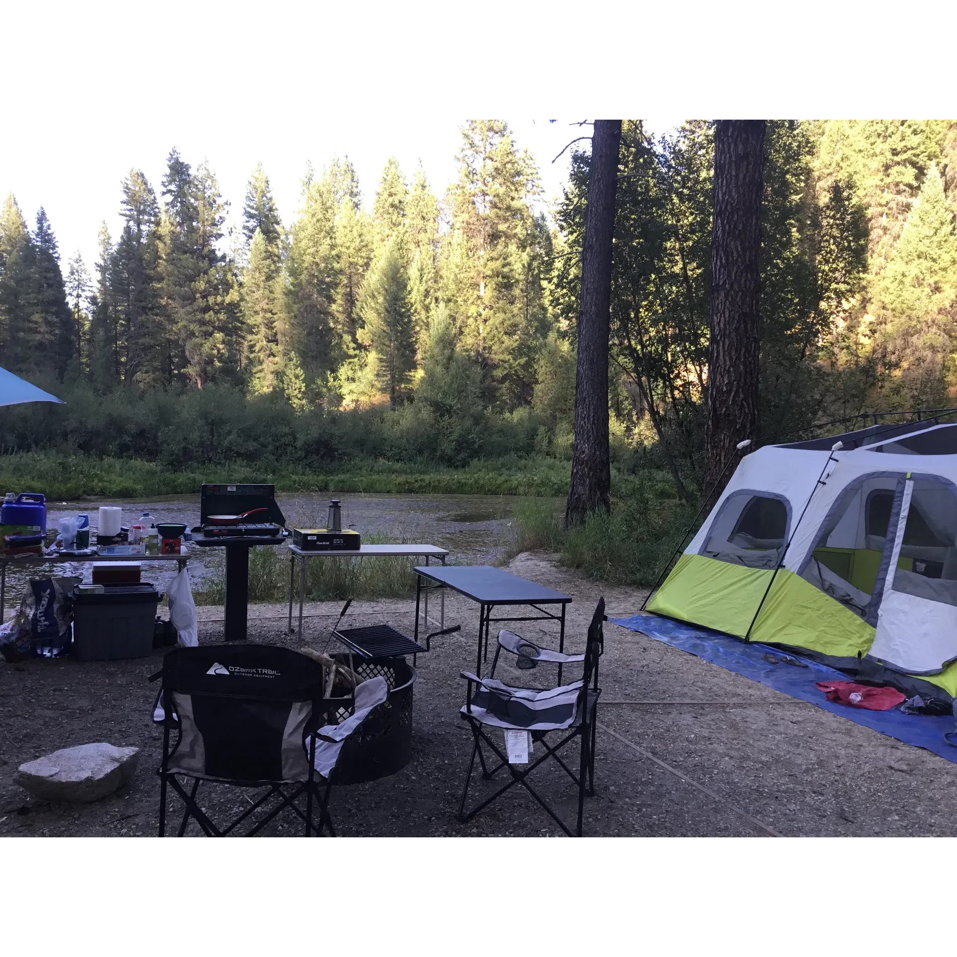 Tie Creek Campground offers outdoor enthusiasts the perfect retreat with well-maintained facilities and the soothing sounds of the river to enhance the camping experience. The campground boasts a reliable drinking water pump, ensuring fresh water for all visitors, and separate bathrooms to cater to the needs of each camper.

With roughly nine sites arranged in a convenient loop, this smaller campground provides a quaint and cozier atmosphere, with an emphasis on spaciousness and comfort. Each campsite is equipped with updated amenities including a barbecue, fire pit, and table, perfect for gathering around a warm meal or sharing stories under the stars. Campers can enjoy ample space for tents, with individual sites adequately sized to accommodate a large 12-person tent alongside a smaller one, with room left to spare.

The campground welcomes your furry companions, with specific areas designated for leashing dogs, ensuring a comfortable stay for pet owners. For RV adventurers, suitable spots are available to set up camp and enjoy the surrounding natural beauty. Additionally, overflow parking is generously sized, catering to up to five large vehicles, so you never have to worry about finding a place to park.

Conveniently located just off a paved road, Tie Creek Campground offers vault toilets and easily accessible water sources. Many of the outer campsites offer direct access to the river, a serene escape for those looking to immerse themselves in the tranquil sounds and sights of the water.

While it's suggested to arrive early due to the popularity of the campground, visitors have the bonus convenience of purchasing firewood from a local resident nearby, allowing for effortless campfire enjoyment. And for those concerned about the nuisances of outdoor living, the campground has a natural advantage with moving water that deters mosquitos, allowing for a pleasant and itch-free stay.

Tie Creek Campground excels in providing an idyllic setting for those seeking a balance of untamed nature and thoughtful amenities. It's a welcoming destination that has garnered appreciation for its offering of both a peaceful riverside ambiance and the practical comforts of home, inviting campers to return time and time again to this amazing spot. Whether during a refreshing rainstorm or under clear skies, Tie Creek remains a sought-after tent-only haven, promising an unforgettable camping experience. Description by ChatGPT.