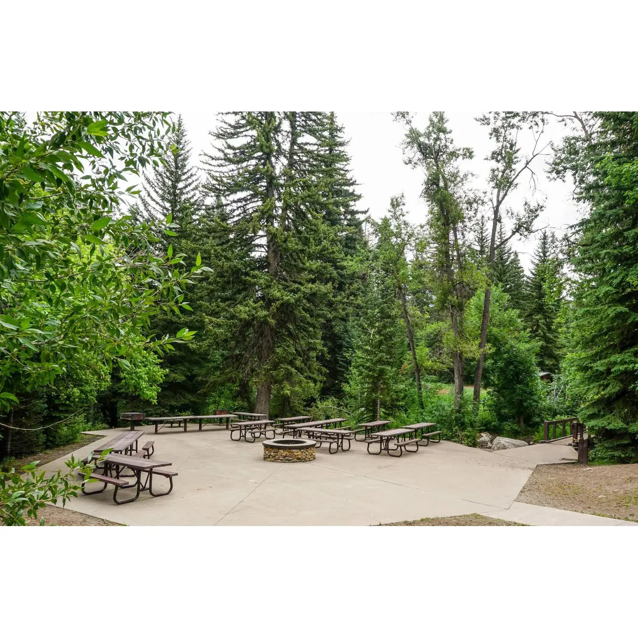 Surrounded by the awe-inspiring landscapes of Uinta-Wasatch-Cache National Forest in American Fork, Utah, the Stonemason Site at Granite Flat Campground is an idyllic getaway for those seeking natural beauty and outdoor adventure. Visitors to the site are greeted by splendid scenery, with a babbling stream that adds to the serene ambiance, making it a perfect location for relaxation and connecting with nature.

The campground is equipped with inviting cooking and fire pit areas, ideal for preparing meals under the open sky and sharing stories around a crackling fire. Guests enjoy well-maintained spaces which are ideal for a variety of activities, including playing and camping. Conveniently located parking spots offer easy access to the site, ensuring that transporting gear from vehicles to the campsite is hassle-free, with the added comfort of having a nearby dumpster to maintain a clean environment.

Situated in close proximity to the popular Tibble Fork Reservoir, Stonemason Site offers a comparable aquatic experience right at the campground, with a stream that boasts water temperature akin to that of the reservoir itself. This proximity allows guests to enjoy water activities without the challenge of navigating the busy surroundings of the reservoir.

Explorers and nature enthusiasts will appreciate the vast network of trails and captivating river areas where they can embark on a journey through the wilderness, whether for a leisurely ride or an adventurous hike. The expansive grounds are a haven for groups, providing ample space and privacy, making it an excellent choice for large gatherings or families who prefer a more self-sufficient camping experience.

Truly, the Stonemason Site at Granite Flat Campground offers an exceptional retreat for those looking to immerse themselves in the splendor of American Fork's majestic outdoors. Description by ChatGPT.