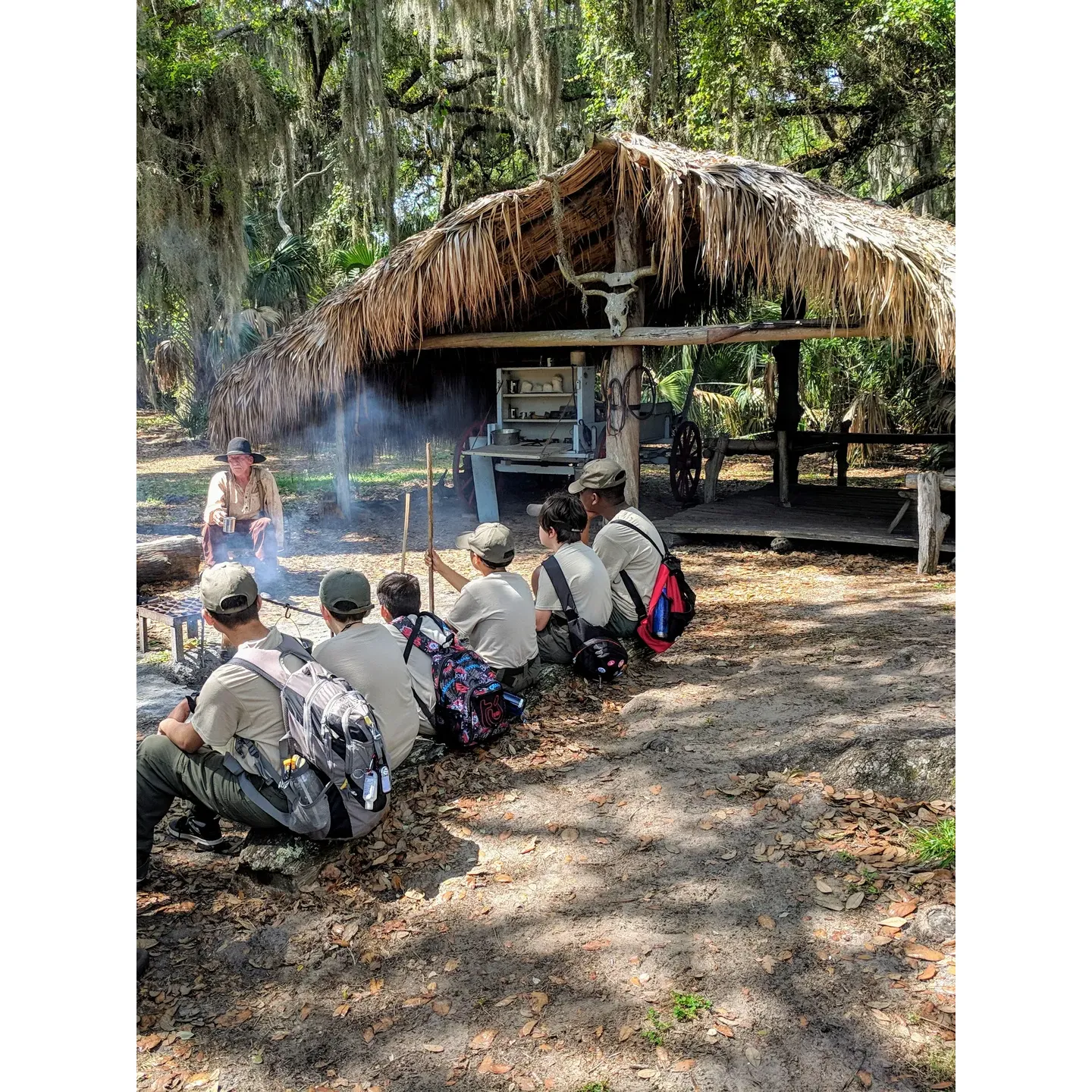 Discover a captivating journey through time at the Cow Camp within Lake Kissimmee State Park, where visitors are transported to the year 1876 to experience the rugged life of a Florida cow hunter. Embrace the enchanting charm of old Florida through lively song and heritage at this treasured historical exhibit, where the echoes of "cracker" cow hunter culture resonate through the moss-draped oaks and sun-kissed prairies.

Indulge your curiosity with a guided hike along picturesque trails, led by knowledgeable guides like Isaac, who eagerly impart local history and ecological insights, turning a simple walk into an educational adventure. Guests rave about the quality of these guided experiences, planning return visits not only for the hikes but also to enjoy the serene campsites that promise a perfect blend of nature and nostalgia.

Cow Camp offers an authentic and thoughtfully presented portrayal of cowboy life in 19th-century Florida. Engaging historical interpreters, donning period attire, deliver enthralling stories that captivate audiences of all ages, providing a deeper understanding of the state's pastoral past. It's an exceptional opportunity to immerse oneself in the history of Florida's cattle herding heritage.

Tucked within the expansive beauty of one of Florida's most scenic state parks, Cow Camp might be compact, but its impact is profound. It's an integral piece of a larger puzzle that forms a meaningful appreciation for the region's history. Visitors are encouraged to journey along the scenic path that leads to the camp, enhancing their park exploration with a touch of living history.

Even the most discerning guests surprised themselves with how much enjoyment they found at Cow Camp. Its simplicity is its charm, offering a respite from the modern world and a chance to connect with the past. Families find it particularly engaging, with even teens expressing newfound interest in Florida's cattle-driving heydays.

Cow Camp stands out as a unique attraction that complements the natural beauty and outdoor recreation of Lake Kissimmee State Park. It's an educational gem where inquisitive minds can delve into the intricacies of the cattle trade once driven by the Spanish, all within the context of an immersive historical setting. Sure to enlighten and entertain, the Cow Camp experience is an unforgettable slice of the 'Real Florida,' eagerly shared and remembered by those who visit. Description by ChatGPT.