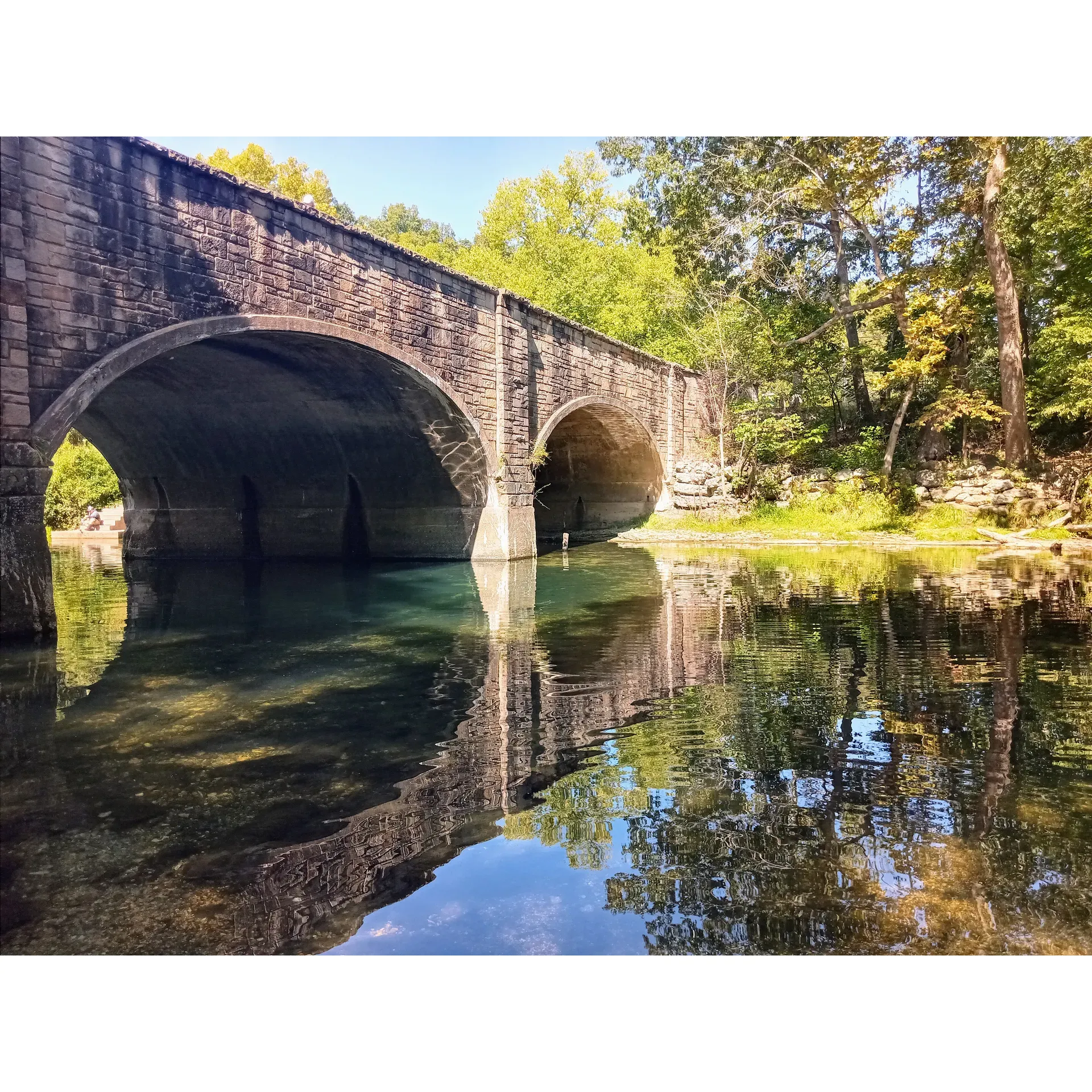 Bennett Spring State Park Campground is an idyllic retreat for families, outdoor enthusiasts, and anyone looking to indulge in a serene camping experience. Embraced by the beauty of Mother Nature, the campground shines with its immaculate conditions, welcoming four-legged friends, and boasting a well-maintained playground that guarantees joyous laughter from kids.

A haven for anglers, the park provides a top-tier fishing experience with clearly marked areas and streams abundantly stocked, ensuring the satisfaction of every fishing aficionado. Those interested in the sport will appreciate the availability of reasonably priced trout tags, along with the necessity of a fishing license and a daily tag to preserve the park's integrity and fish populations.

Promising an unforgettable experience, the campground offers both traditional camping and cabin accommodations, perfectly suited for creating lifelong memories. Whether it's celebrating a 50th wedding anniversary or continuing a cherished 35-year family tradition, visitors find a welcoming atmosphere that calls them back year after year.

For convenience, the campground includes an on-site restaurant and a well-stocked store, catering to all camping essentials. Despite ongoing renovations to enhance the dam and hatchery area, the park's commitment to upkeep remains evident, ensuring facilities like the playground remain open and inviting.

In addition, the campground's riverside setting is perfect for those looking to float or fish in a picturesque environment. The thoughtful inclusion of quiet times ensures that all guests can enjoy the tranquility of one of the state's best parks.

Overall, Bennett Spring State Park Campground is a premium choice for those seeking to unwind, connect with nature, and relish in an atmosphere of friendliness and cleanliness. The promise of summer fun keeps guests eagerly anticipating their next visit, securing its place as a beloved destination for many. Description by ChatGPT.