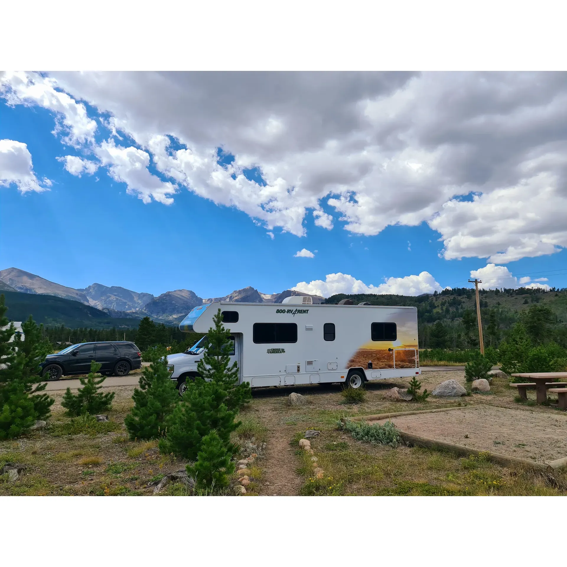 Glacier Basin Campground offers the quintessence of outdoor living with its spacious and well-maintained sites, providing an idyllic retreat for both tent and smaller trailer campers amidst the splendor of Rocky Mountain National Park. With its prime location, the campground presents stunning mountain vistas that serve as an enchanting backdrop while you wake to the serene beauty of nature. Each campsite is meticulously cared for, offering clean and accessible restroom facilities with running water, a testament to the effort placed in ensuring the comfort of all guests.

For added convenience, the campground is strategically positioned to give guests immediate access to essential amenities and to enhance their outdoor experience. This includes readily available bear boxes for safe food storage, and the selling of ice and firewood on-site, which underscores the campground's commitment to providing a hassle-free stay.

One of the campground's most lauded features is its proximity to the free shuttle bus service, opening the gates to effortless exploration of the park's famed trailheads along the Bear Lake corridor. This invaluable service not only alleviates parking woes but also enhances the accessibility to Estes Park, easing the journey into town for guests who yearn for local adventures without the hustle of traffic.

Visitors to Glacier Basin Campground are often delighted by the wildlife encounters and bountiful recreational activities that surround them. From the majestic sights of moose, elk, and deer to the diverse hiking trails minutes away, there is never a shortage of natural wonders to behold or explore. Additionally, the friendly and knowledgeable staff, ranging from rangers to park attendants, are ever-present to ensure a welcoming and supportive environment, ready to assist and enrich your park experience.

The campground’s thoughtful layout includes diversified sites, some offering more seclusion for those seeking tranquility, and others positioned for optimal facility access and majestic views, catering to the preferences of different travelers. C099, a tent-only, non-generator site, exemplifies such a sought-after campground experience, boasting breathtaking mountain views paired with the ease of nearby restroom and washing facilities.

Glacier Basin Campground represents the perfect union of raw natural beauty and guest-centric amenities, solidifying its reputation as one of the best national park campgrounds. It's the perfect staging area for adventurers and nature lovers to immerse themselves in the outdoor splendor that is Rocky Mountain National Park. Description by ChatGPT.