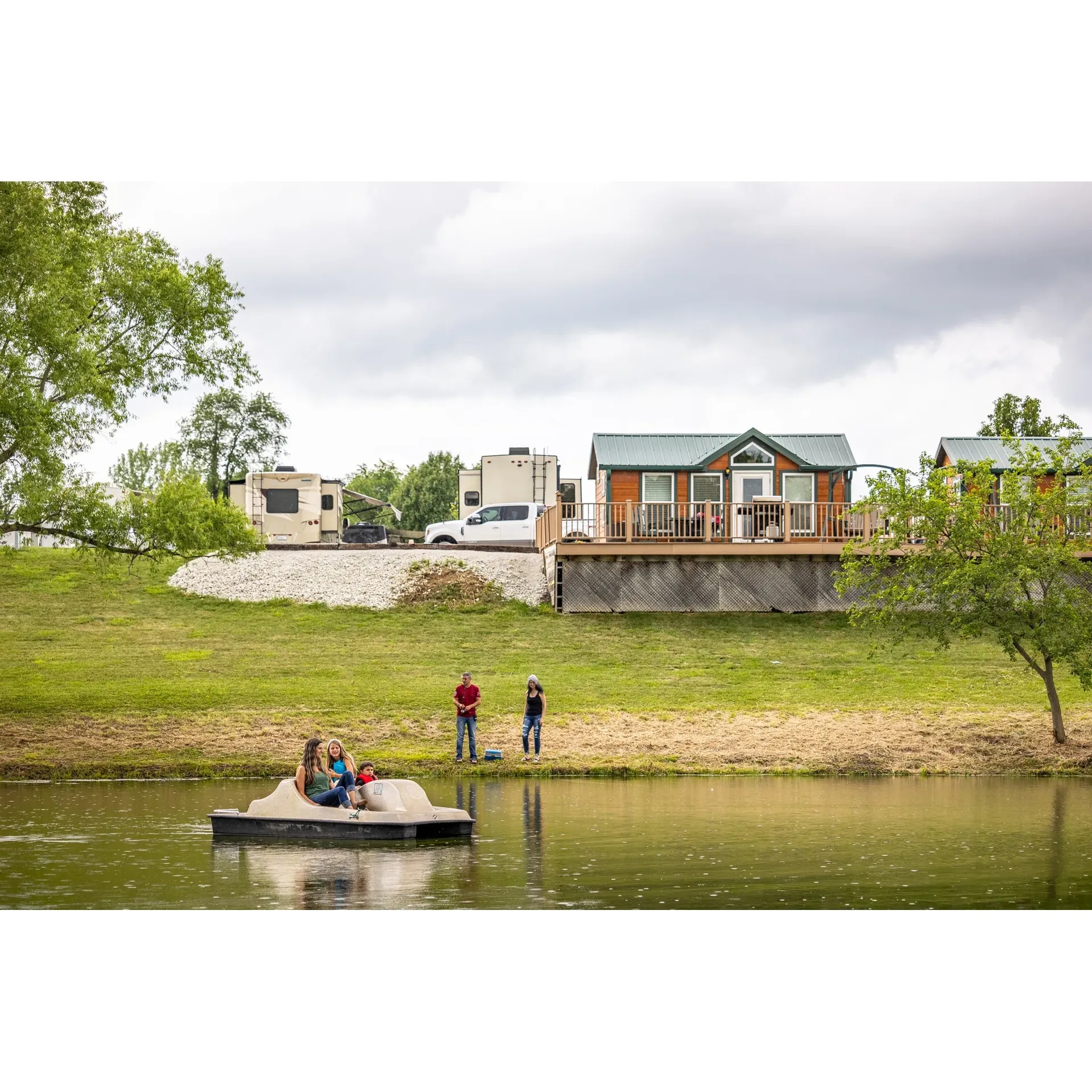 Des Moines West KOA Holiday emerges as a tranquil oasis for those seeking a serene getaway, coupled with the convenience of modern amenities and exceptional hospitality. The well-maintained grounds offer a picturesque setting that allows guests to immerse themselves in the beauty of the natural surroundings while providing a peaceful retreat away from the hustle and bustle of nearby highways.

The campground is a haven for those looking to indulge in an array of activities, with an inviting pavilion that hosts movies—perfect for an enjoyable evening under the stars. The effortless interactions with the office staff add a personal touch to the experience, where guests are greeted with warmth and escorted to their sites for a streamlined arrival. The daily garbage pickup service underlines the staff's commitment to maintaining a pristine and welcoming environment.

Adding to the unique charm of Des Moines West KOA Holiday is the novelty of having freshly made pizza delivered right to your site, exemplifying the site's efforts to go above and beyond in providing convenience and comfort. During unforeseen weather events, the proactive communication via text updates and the accessibility of a clearly marked storm shelter underscore the campground's dedication to guest safety and peace of mind.

Whether passing through or seeking a restful stay, guests will find solace in the idyllic settings of the cabins, which boast views overlooking a scenic pond, offering a slice of tranquility and an escape from the noise of everyday life. The meticulous care evidences itself in the cleanliness and manicured appearance of the sites and lush grass, creating an environment where guests can relax and reconnect with nature.

The practical amenities such as a dog park, playground, and laundry facilities cater to the needs of all guests, making family stays and those traveling with pets equally convenient. The nearby grocery store allows for easy resupply and adds another layer of convenience for those who wish to extend their stay.

Overall, Des Moines West KOA Holiday stands out as a charming retreat that balances the beauty of the great outdoors with the comforts and reassurances of a well-facilitated and caring environment. Whether seeking a fleeting respite or an extended holiday, this KOA provides an exemplary camping experience, swept in the quietude and splendor of Iowa's picturesque landscapes. Description by ChatGPT.