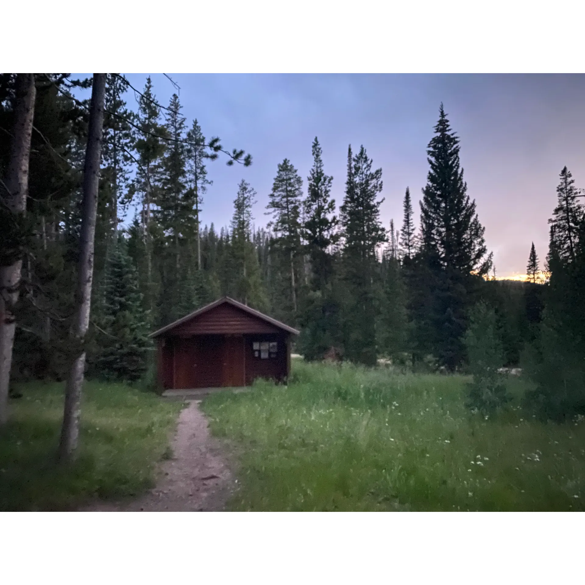 Lynx Pass Campground offers a serene and picturesque retreat into the heart of Colorado's pristine wilderness. Ideal for those seeking a tranquil escape, the campground presents an array of eleven individually unique campsites designed to cater to various preferences, from secluded spots shrouded in the surrounding natural beauty to those with panoramic vistas of the tranquil lake frequented by the majestic moose. 

Outdoor enthusiasts will appreciate the thoughtfully arranged amenities including picnic tables, fire rings for cozy evenings under the stars, and level tent pads to ensure a comfortable night's rest. Accessibility is seamless, with most sites featuring convenient half-moon pass-through parking that accommodates larger vehicles or multiple cars.

This charming campground is celebrated for maintaining immaculate facilities, including a clean vault toilet restroom centrally located for ease of access. Hand sanitizer dispensers are also available for added convenience. While the campsite is a respite from modern distractions without power or running water, a hand-operated water pump offers a rustic experience for non-drinking needs.

Visitors are encouraged to arrive prepared with their own drinking water to fully enjoy the peaceful surroundings. Whether you're looking to unwind after a day of cycling or seeking a quiet getaway from the bustling city life, Lynx Pass Campground is a perfect choice, even accessible to those in smaller vehicles like a Civic. Embrace the chance to connect with nature, relish the simplicity of camping, and create lasting memories in this enchanting setting. Description by ChatGPT.