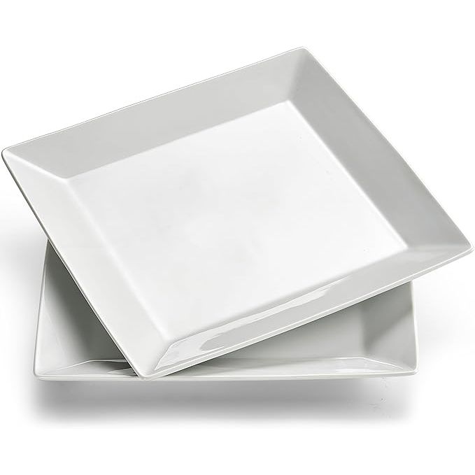 This 10.6" porcelain dinner plate in simply white is a versatile and elegant addition to any kitchen or dining table. With a square shape, this plate is perfect for serving salads, steaks, pasta, snacks, and more. The set includes 2 plates, making it ideal for both everyday use and special occasions in restaurants or at parties.