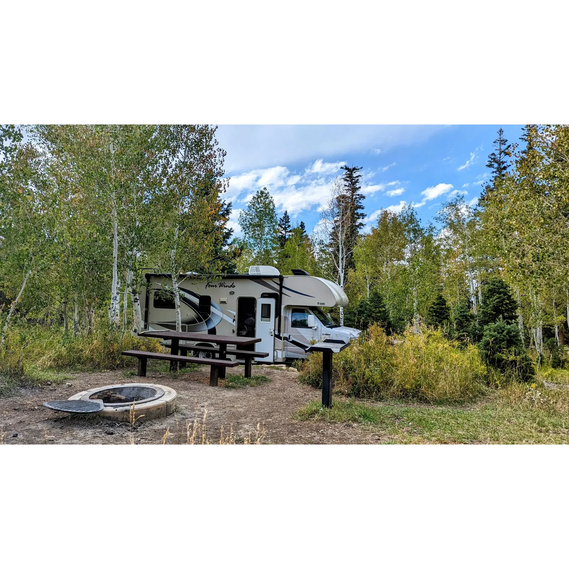 Lake Hill Campground offers a serene outdoor haven for nature enthusiasts and camping adepts alike. Set in a scenic landscape surrounded by towering pine and aspen trees, this picturesque destination provides an ideal setting for recharging amidst nature's splendor.

A hit with anglers and casual fishers, the campground boasts a tranquil lake that invites guests to indulge in leisurely fishing experiences. Additionally, the space caters to leisure walks and hiking for those seeking to immerse themselves in the lush environs or enjoy the network of available trails for thrilling razor riding adventures.

Families find a special allure with group campsite options that are not only budget-friendly but also offer abundant opportunities for children to play and explore. Ample shade ensures comfort even during warmer days, while the availability of potable drinking water adds to the convenient amenities offered on the grounds.

Camping sites have been thoughtfully designed to provide privacy and a sense of seclusion, each with its own grill stand and picnic table allowing for cozy gatherings and delightful outdoor meals. An unexpectedly clean pit toilet service complements the rustic charm while maintaining hygienic conditions.

The allure of this campground is enhanced by its capacity to accommodate a variety of outdoor activities. From casual strolls in the summer's full bloom of grass and wildflowers to seeking adventure on horseback or off-highway vehicles, Lake Hill Campground is a perfect backdrop for a plethora of experiences.

At night, the campground provides an enchanting escape from the hustle and bustle, perfect for those in search of tranquility under a starlit sky. The distinct surroundings play host to local wildlife, creating magical encounters with squirrels, birds, and butterflies that add to the memorable stays of all visitors.

Lake Hill Camp, with its beautiful campsites sprawling between birch and aspen clearings, stands as a dreamy retreat for anyone looking to create lasting memories in the great outdoors. Description by ChatGPT.