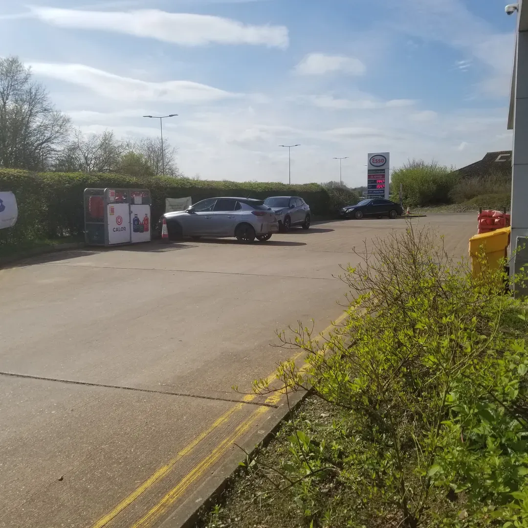 As you pull into the familiar Esso station, you'll now find a fresh look with the transition to Asda Express, ensuring continuity and convenience for all of its customers. Despite the changeover, the station proudly continues to offer Esso's quality fuel, while also accepting the same fuel cards, making refueling convenient and familiar for regular customers.

Those looking for a quick bite or essential items will find a good selection of stock at reasonable prices. The on-site convenience store provides a range of products to suit your travel needs and everyday essentials, enabling visitors to pick up items quickly and efficiently.

Adding to the experience, the station features a 'Starbucks on the go,' where customers can indulge in their favorite Starbucks beverages without the need for a café. Coffee lovers can enjoy the comforting taste of their preferred brews, providing a perfect pick-me-up for the journey ahead.

Loyalty is rewarded here, as customers can continue to collect Nectar points with their purchases, a gesture that both recognizes and values the regular patronage of its customers.

The staff at this Esso station are known for their excellent service, greeting each customer with a friendly smile and going out of their way to ensure patrons leave satisfied. Customer service is clearly a priority here, providing a positive and personable experience for everyone.

Additionally, the station is designed to accommodate the needs of drivers with plenty of parking space available, making it a convenient stop even during the busiest hours. For those needing cash on-the-go, the complimentary cash machine offers further convenience without additional cost.

Whether it's a simple refuel, a quick snack, or merely a pause in your travels, this Esso station and Asda Express have become a trusted pit stop for many, known for its positive attributes and consistent service. Description by ChatGPT.