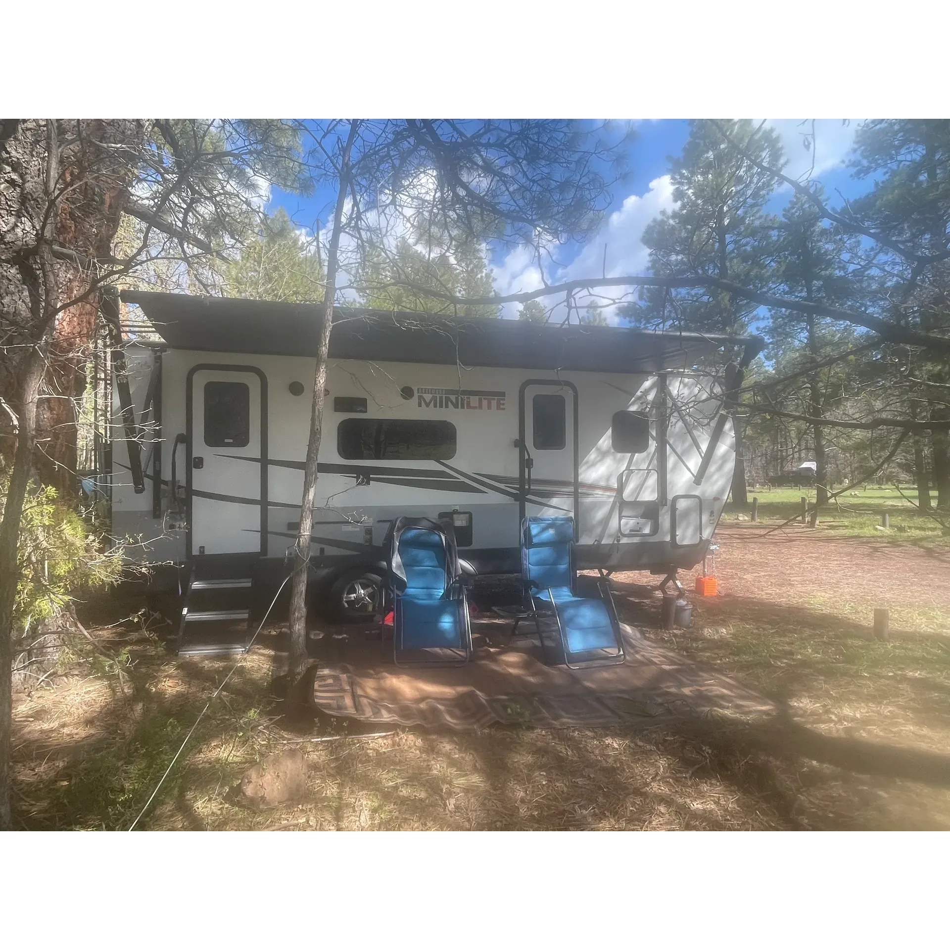 Double Springs Campground offers the perfect retreat for outdoor enthusiasts looking for a serene, welcoming, and spacious environment. Conveniently located within a comfortable distance from Flagstaff, it provides an ideal base for visitors seeking relaxation or a touch of adventure. The campground boasts pristine bathrooms lauded for their exceptional cleanliness, ensuring a comfortable and hygienic stay for all guests.

Set amidst lush greenery, the campsite is surrounded by vibrant flora that enhances the tranquil atmosphere. Frequent sightings of wildlife and the soothing sounds of nature contribute to a genuine back-to-nature experience. With a variety of birds and animals in the vicinity, nature lovers are in for a treat.

Camping sites at Double Springs Campground are generously sized, allowing for ample personal space and privacy. Certain sites, such as Sites 2 & 3, offer an excellent arrangement for dual-family stays, creating a sense of community while maintaining individual privacy. For those seeking seclusion, Sites 14 & 15 provide an even more secluded setting, tucked away for a peaceful and calming escape.

Visitors can expect a friendly reception from the local campground host, who strives to ensure a pleasant stay for all guests. The beautifully maintained pathways and common areas invite guests to explore and enjoy their surroundings. Moreover, hikers traversing Passage 29 to 30 of the Arizona Trail will find this campground to be a delightful and restful stopover.

The distinguished presence of a camp goat adds a unique charm to the overall camping experience, as it makes its daily rounds greeting visitors. Collectively, Double Springs Campground represents a charming getaway where one can enjoy the great outdoors with comfort and ease. Description by ChatGPT.