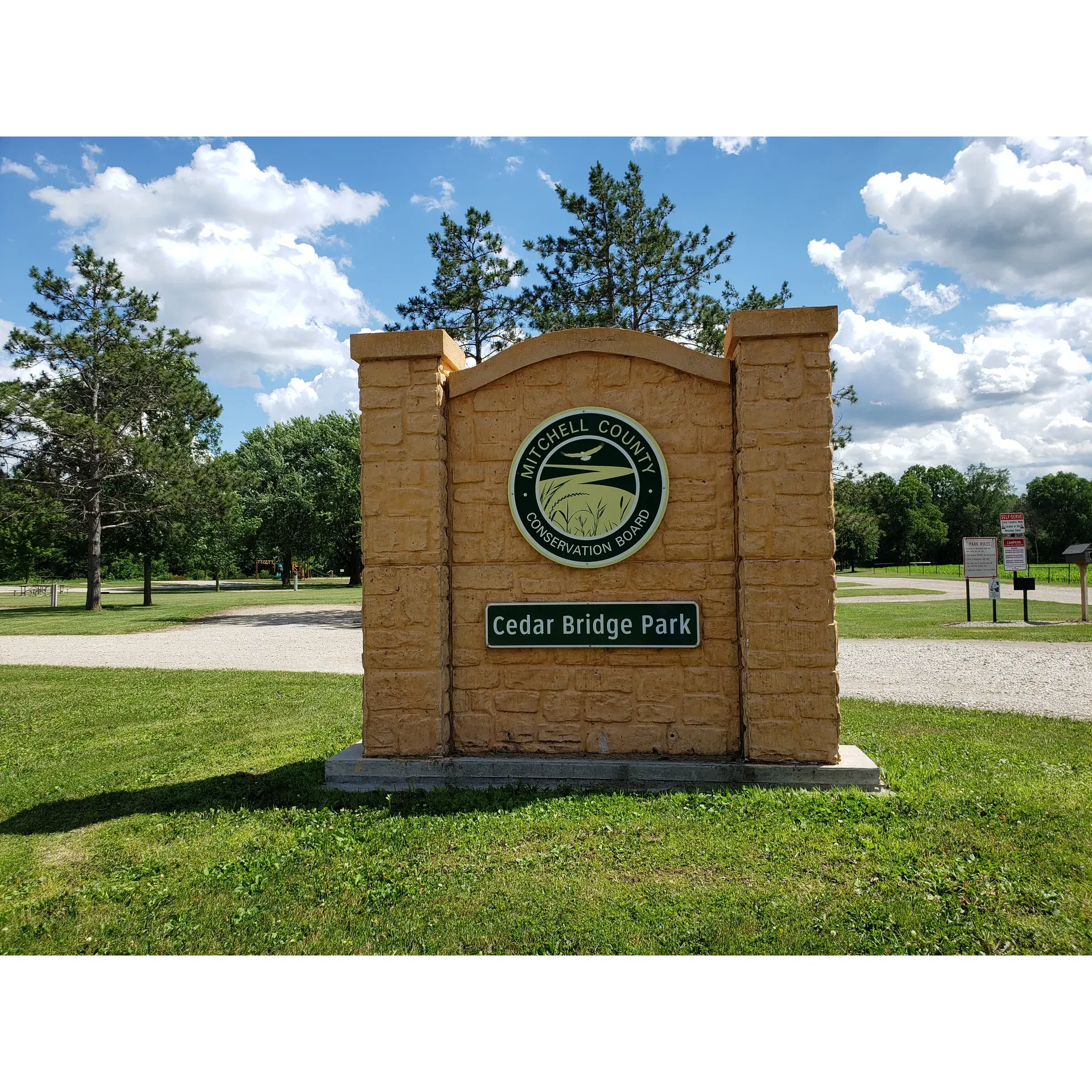 Cedar Bridge Park offers a serene and inviting retreat for outdoor enthusiasts with its tidy and well-maintained campground just beyond the outskirts of Osage. Boasting roughly 20 campsites, the park caters to visitors with essential modern amenities, including water and electric hookups at each site, ensuring a comfortable stay for both tents and RVs. The presence of an on-site dump station adds a layer of convenience for guests.

Families and individuals are drawn to Cedar Bridge Park for its picturesque riverside cabins, ideal for those seeking a tranquil getaway. Highlighting the natural charm of the area, visitors can indulge in the simple pleasure of a campfire while enjoying the soothing sounds of the nearby river. It's a place that has become a cherished annual destination for family gatherings, with guests returning year after year to bask in the park's peaceful ambiance.

The park's infrastructure accommodates for a spontaneous walk-up camping experience, perfect for those seeking a spur-of-the-moment outdoor adventure. Additionally, the gravel campsites are known for their level ground, providing a stable foundation for setting up camp. Many locations within the park offer the comforting shelter of shade, which is particularly appreciated during warmer days.

Moreover, Cedar Bridge Park ensures the well-being and comfort of its guests with clean and functional restroom and shower facilities, and continues to maintain a strong focus on the overall upkeep of the park. With reasonable rates that include the convenience of electricity and water, Cedar Bridge Park stands out as a desirable and affordable destination for those looking to immerse themselves in nature's beauty without forgoing the comforts of home. Description by ChatGPT.