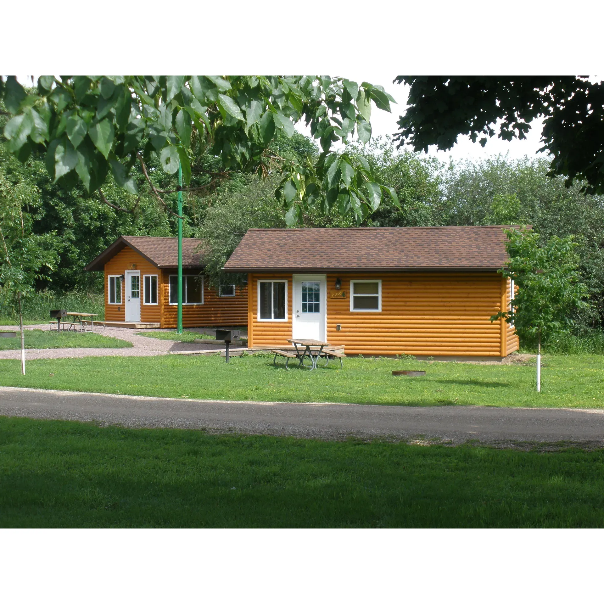 Sleepy Eye Campground offers a serene and picturesque escape for outdoor enthusiasts. Boasting beautiful lakeside sites, this charming campground provides an array of fun and relaxing amenities. Guests can revel in the pleasure of fishing from the docks, embark on boating adventures, or enjoy a leisurely paddle with convenient kayak rentals, easily accessible with a quick scan-and-pay system.

Family-friendly and welcoming, the campground features a well-equipped playground sure to delight the little ones, along with immaculately maintained restrooms and showers that set a standard for cleanliness. For those seeking sheltered spaces for gatherings or picnics, the covered pavilion presents an ideal venue.

On-site conveniences include efficient electrical and water hookups, a thoughtfully positioned dump station, and sizable waste management facilities ensuring a tidy and well-serviced environment. Security is quietly underscored by the reassuring presence of the local police department, maintaining a safe and peaceful atmosphere for all campers.

Additionally, guests have the option to indulge in a home-away-from-home experience by renting one of the two cozy cabins, complete with ample room and air conditioning for those warmer days. The cabins complement the rustic yet comfortable vibe of the campground.

Embracing a more active lifestyle is effortless at Sleepy Eye Campground, with its inviting frisbee golf course and trails that beckon hikers and cyclists to explore the natural beauty of the area. Moreover, the site's proximity to the quaint downtown Sleepy Eye - only a mile away - promises charming local encounters and convenience.

For the explorers, the campground serves as a perfect gateway to nearby attractions, such as the historic significance of Fort Ridgley State Park, and the cultural offerings of New Ulm, each just a short drive away.

Guests praise the campground for its endearing size, which contributes to a sense of community and personalized experience. Online reservation and payment options offer the ease of planning, ensuring that every visit is as stress-free as possible. Sleepy Eye Campground is not just a mere retreat, but a consistently favored destination for families and individuals who appreciate the outdoors, served with a healthy dose of hospitality and care. Description by ChatGPT.