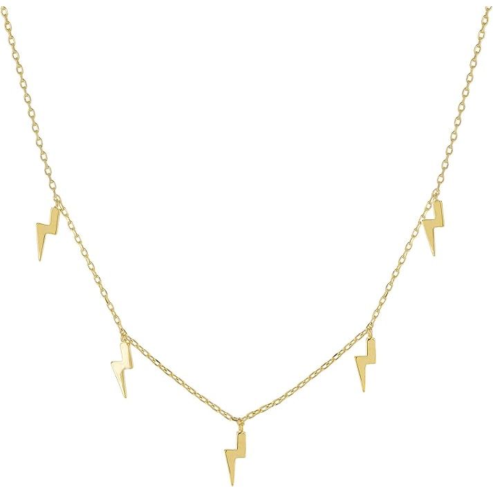 The Columbus 14K Gold or Rhodium Plated Charm Necklace is a stylish and versatile piece of jewelry that is perfect for everyday wear. The necklace features a lightning bolt pendant that adds a touch of edgy charm to any outfit. It also has a star station necklace that adds a celestial element to the design.