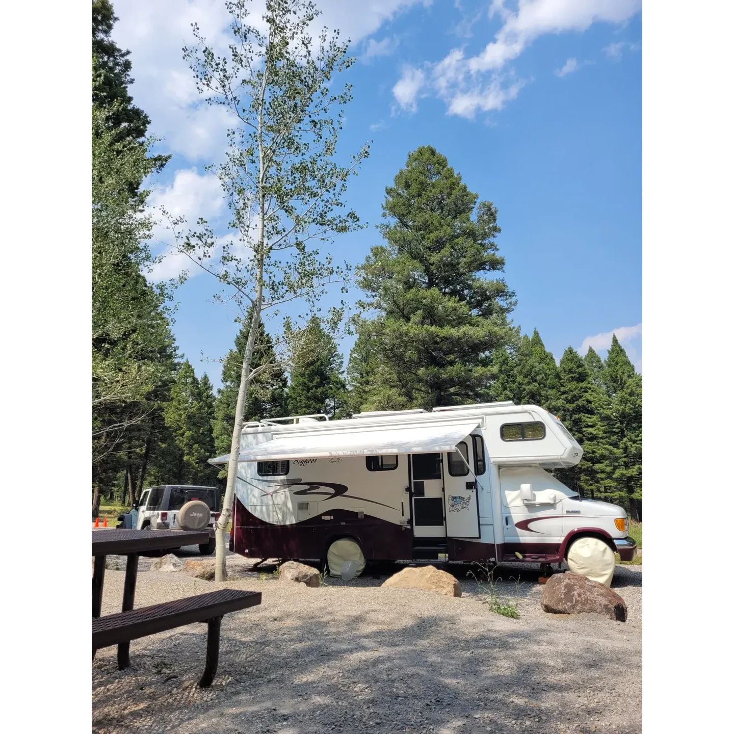 Stoddard Creek Campground is a charming outdoor retreat perfectly situated for travelers seeking a scenic stopover between the iconic landscapes of Glacier National Park, Yellowstone, and Grand Teton National Park. Its accessible location is just a short drive from the highway, along a well-maintained paved road, leading visitors into the serene embrace of a lush pine forest set upon gentle hills. With its spacious, shaded, and secluded spots, the campground offers a bright and cheerful woodland atmosphere that sets the stage for a delightful outdoor experience.

A family-friendly destination, Stoddard Creek Campground provides an idyllic environment for children to play and explore, while the adults unwind amidst nature's tranquil backdrop. The facilities are notable for their exceptional upkeep, with some of the cleanest and freshest pit toilets available, enhancing the comfort of your stay. Conveniently dispersed throughout the campground, fresh water spigots ensure that guests never have to wander far for a refreshing drink or to refill water containers.

For those seeking a unique overnight experience, hanging a hammock between the trees here promises a restful night's sleep, under a canopy of stars. While there is some awareness of the nearby highway, it melds into the background, adding to the sense of connectivity while maintaining a peaceful ambiance. Guests planning their journey should note the local amenities, like gas availability and the intriguing opal mines nearby, which might add an unexpected adventure to their trip.

Stoddard Creek Campground is appreciated by both visitors and locals, with some guests making the trek from just 65 miles away to bask in its charm. The campground proves to be an engaging basecamp not just for RVs but also for tent campers, encouraging all to immerse themselves in the great outdoors. The welcoming and helpful presence of the campsite host, noted for his knowledge and affable nature, adds a personal touch that leaves a lasting impression. Whether it's a leisurely stay or an adventurous pit-stop, Stoddard Creek Campground stands out as a cherished spot to relax and recharge in the grandeur of the American West. Description by ChatGPT.