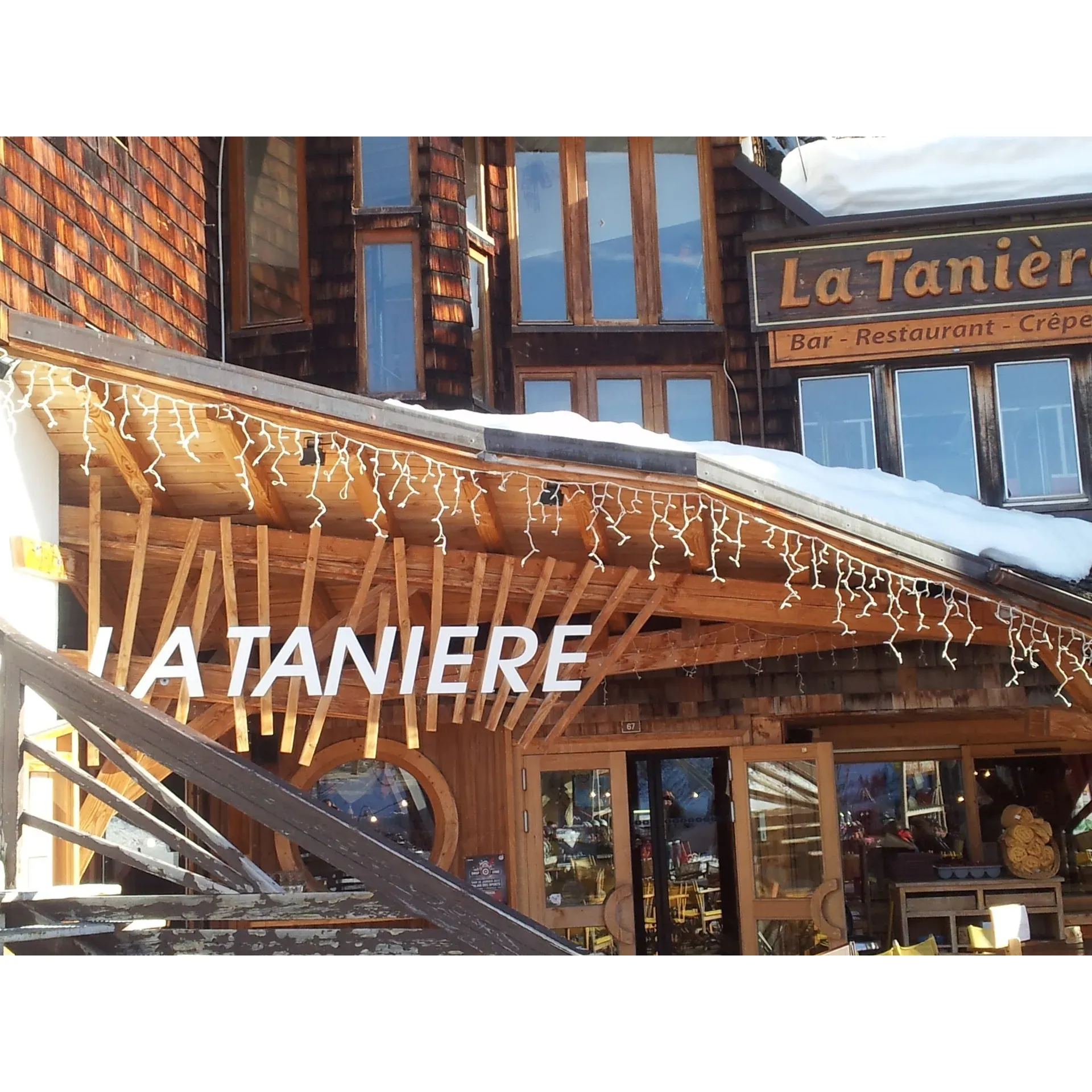 La Tanière - Restaurant Pizzeria presents a delectable escape for diners seeking a warm culinary experience, conveniently located at the peak of the Prodains Express and a stone's throw away from the gondola lift to Morzine. This bustling culinary haven is a favored spot among skiers and food enthusiasts alike, offering an extensive menu that caters to a variety of palates, featuring everything from classic pizzeria fare to the globally inspired dishes.

The restaurant prides itself on its scrumptious pizzas and its unique offering of the poke bowl, consistently receiving praise for their mouth-watering flavors. Authentic local cuisine is given a place of honor, with dishes like the chicken pasta adorned with hearty root vegetables and mushrooms drawing diners in for a taste of the region’s bounty. Not to be missed, the sensation-filled sweet options, such as the extraordinary profiteroles, add a delightful endnote to any meal.

Visitors will find the outdoor dining area a spacious and inviting atmosphere to relax and enjoy their food while taking in the surrounding alpine views. This generous portion restaurant also delivers on value, with reasonable pricing that is appreciated by its guests. On a highlight, the Gourmande options leave gourmets delighted with the freshness and quality of each dish prepared to order.

For those with a sweet tooth, the unforgettable crepe tanière offers a celebration of flavors, large enough to bring friends together for a shared culinary adventure. Diners consistently recommend trying out the plat du jour, highlighting dishes like the chicken burger for its delightful taste.

The charming interior ambiance is further enlivened by a cozy wood fire, creating an inviting atmosphere where one can escape from the chilly outdoors. For convenience, there are facilities to hold skis, ensuring that skiers can easily transition from the slopes to the comforts of the restaurant.

While the ever-popular nature of La Tanière - Restaurant Pizzeria leads to a vibrant and energetic setting, many patrons eagerly return for the food quality and variety, as well as the unique dining experience it offers at every opportunity. As a testament to the restaurant's allure, satisfied patrons often feel compelled to share their positive dining experiences, even while still seated at their tables, a clear sign of La Tanière's magnetic draw as a culinary gem in the area. Description by ChatGPT.