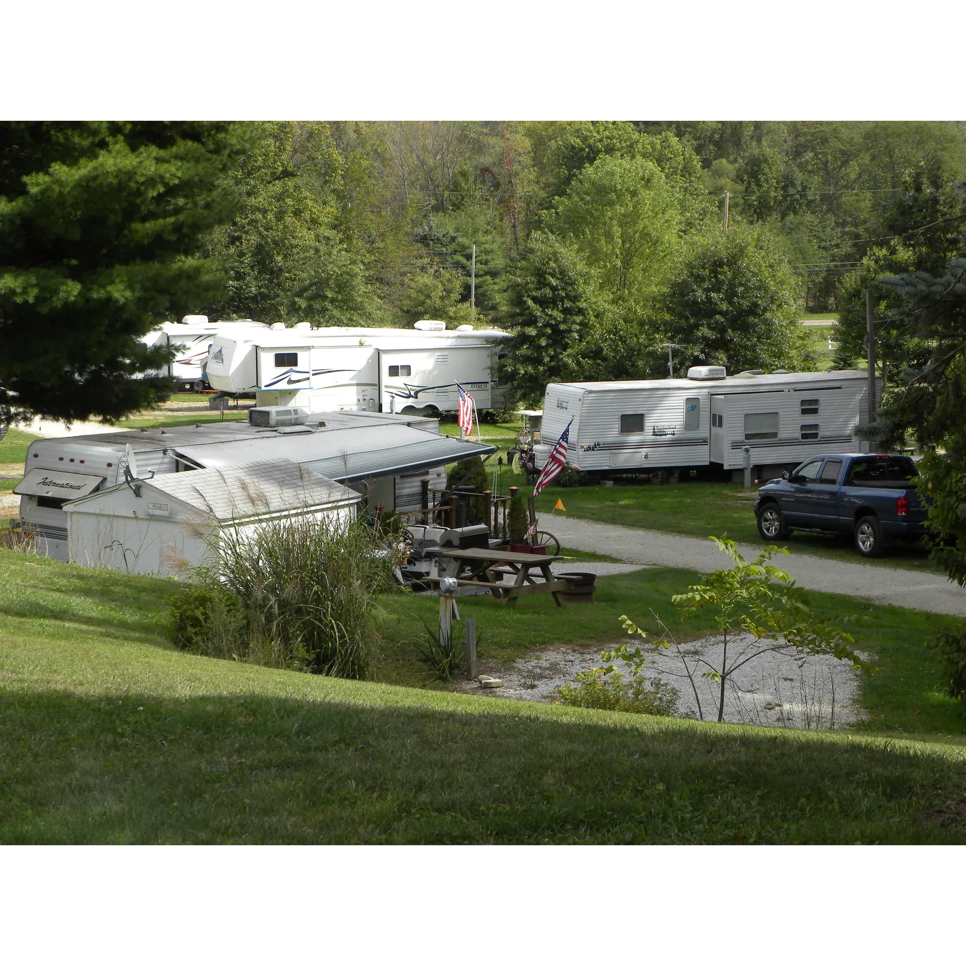 Countryside Camproad offers outdoor enthusiasts the perfect retreat with its prime location near Cuyahoga Valley National Park. This family-owned park provides an array of amenities to ensure a comfortable and convenient stay for all visitors. The campground boasts full hookup sites, including 30A pull-through options, which cater to a variety of RV sizes, complemented by a strong Wi-Fi connection and an abundance of off-air TV channels, courtesy of its advantageous hilltop position.

Guests can enjoy proximity to the serene Mogadore Reservoir, making it a breeze to indulge in fishing, kayaking or simply bask in the tranquil beauty of the surroundings. The campground is not just about natural allure; it also offers leisure facilities such as a well-maintained swimming pool with spotless shower facilities for a refreshing experience after a day of adventure.

Praised for its cleanliness and peaceful environment, Countryside Campground ensures a restful night's sleep. Wide, grassy spots offer ample room for outdoor enjoyment between RV sites. Customer service is a point of pride, with the staff being noted for their accommodating nature, ready to make guests feel welcomed and taken care of throughout their stay.

With its family and pet-friendly atmosphere, the campground provides great entertainment options and prides itself on the absence of complaints by many of its guests. Indeed, it has quickly become a beloved summer camping spot for those who look forward to a season filled with fun, relaxation, and the charm of the great outdoors. Description by ChatGPT.