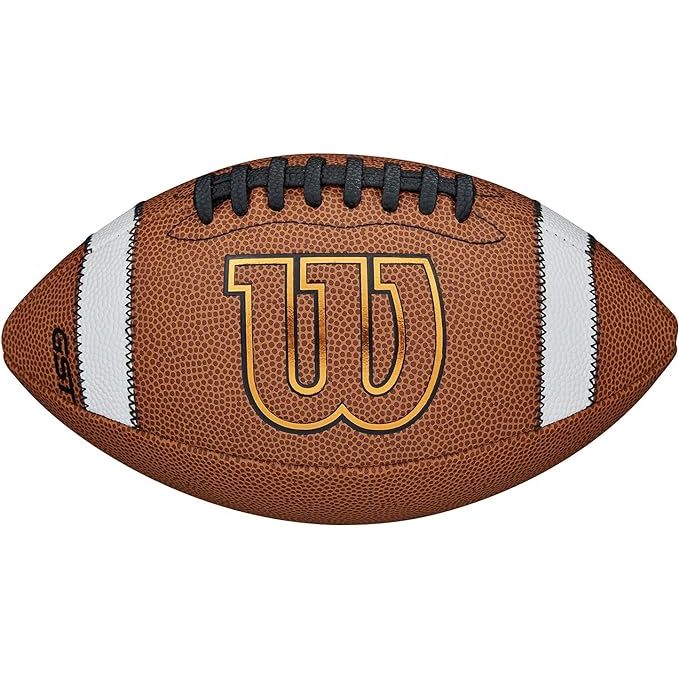 The Wilson GST Composite Footballs - Tan are high-quality footballs designed for professional and recreational use. These footballs feature a composite leather cover that is both durable and provides a superior grip for the players. The tan color of the footballs gives them a classic and sleek look that is easily recognizable on the field.