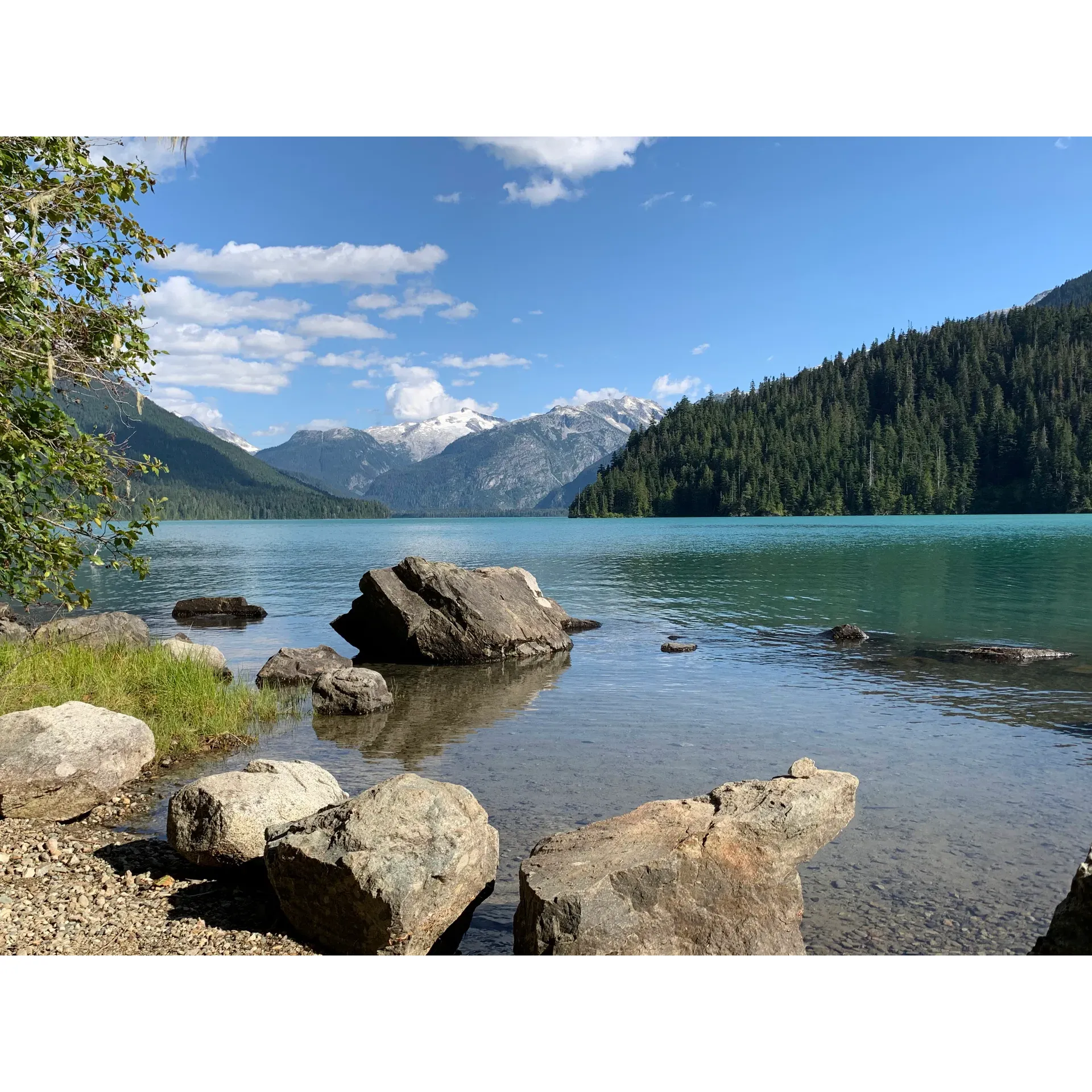 Cheakamus Lake Campground is a serene outdoor escape that promises backcountry explorers a picturesque setting for their camping adventure. Hikers looking for a tranquil retreat will find themselves drawn to the well-maintained trails leading to this peaceful destination. With its magnificent lake panoramas and smooth grounds for setting up camp, the campground offers an idyllic spot for both day trips and overnight stays. 

Visitors can expect to embark on an invigorating 3-mile hike to reach the shores of the pristine lake, enveloped by lush forestry that captures the essence of unspoiled nature. The crystal-clear turquoise waters paired with the expansive blue skies create a slice of paradise, adding to the campground's charm. 

While the journey to the parking lot may be an adventure in itself, the subsequent hike is relatively short, making it accessible for visitors of all ages and perfect for beginner backpackers looking for an easy trail to conquer. With only 14.4km to cover round-trip, it's a destination that beckons early risers to enjoy the beauty of the dawn in quietude.

Campers are reminded to secure a day pass, available from the early hours of the morning, ensuring a seamless visit to this coveted site. The campground provides basic amenities like a potty for convenience, while the surrounding nature offers a pure and natural ambience that encourages visitors to breathe in the forest's fresh scents.

For those ready to wake up with the sun and venture through a scenic path, Cheakamus Lake Campground is a highly recommended haven that rewards its visitors with a feeling of solitude and the untouched splendor of the great outdoors. Description by ChatGPT.