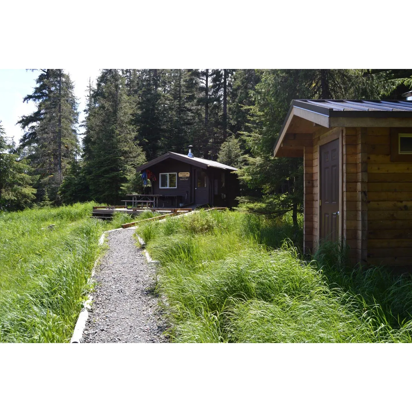 Peterson Lake Campground offers a tranquil lakeside retreat perfect for outdoor enthusiasts seeking a serene getaway. Visitors to this charming hideaway are greeted with the pristine beauty of the Kenai Peninsula, providing an idyllic backdrop for a range of recreational activities.

Boasting clear, shimmering waters, the campground is an excellent spot for lakefront camping, where guests can select from several dedicated and makeshift camp spots. Each location is equipped with picnic tables and fire pits, inviting campers to enjoy meals and cozy fires under the vast Alaskan sky.

The camp's hand pump ensures a supply of water is available, adding to the conveniences offered by this rustic but well-appreciated facility. Additionally, guests have access to two well-maintained restrooms, supporting a comfortable outdoor experience.

Wildlife enthusiasts will relish the opportunity to immerse themselves in nature, where the local fauna flourishes. Experiences such as kayaking, fishing, and photography are just a few ways to engage with the surrounding wilderness. Those looking for relaxation can embark on peaceful walks to soak in the beautiful vistas and tranquility the area provides.

Peterson Lake Campground is a community treasure that operates on a user-maintained ethos, promoting an environment of respect and care among its guests. As a free campground that doesn't require reservations, it's a preferred spot for both spontaneous adventurers and long-term nature lovers who wish to dry camp amidst the serenity of the Alaskan landscape.

For those seeking a low-key, off-the-beaten-path escape, Peterson Lake Campground represents a true hidden gem where the simplicity of nature's gifts offers a profound sense of calm and rejuvenation. Description by ChatGPT.